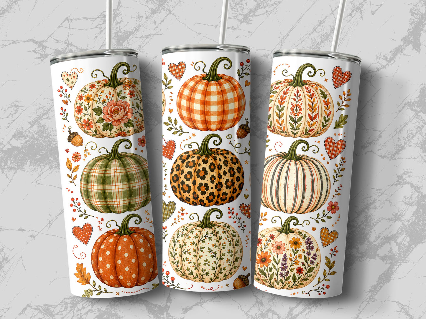 Three tumblers adorned with fall pumpkins, floral patterns, and plaid hearts.