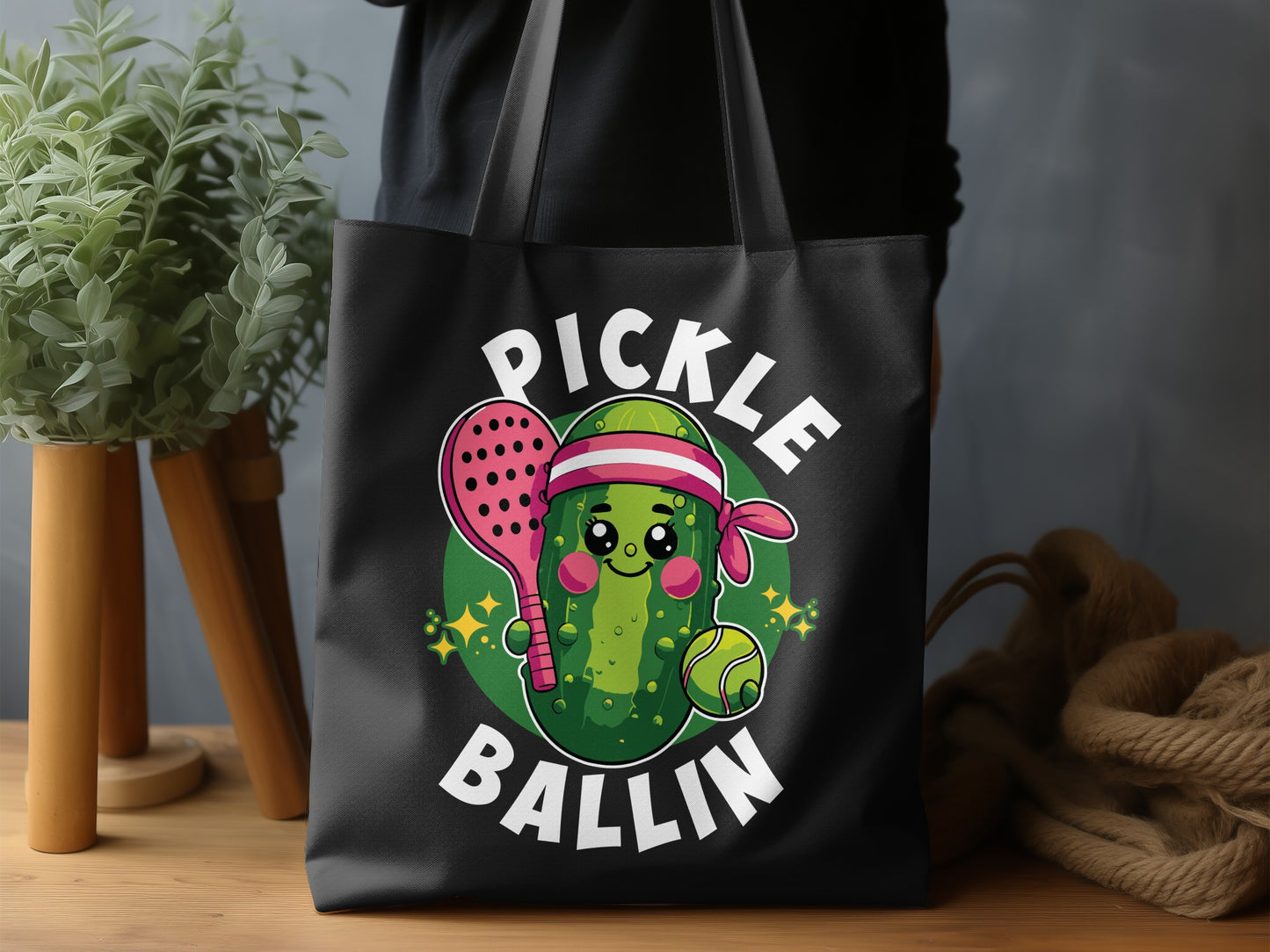 Cute pickle character in headband with paddle and ball, "PICKLE BALLIN'" text.
