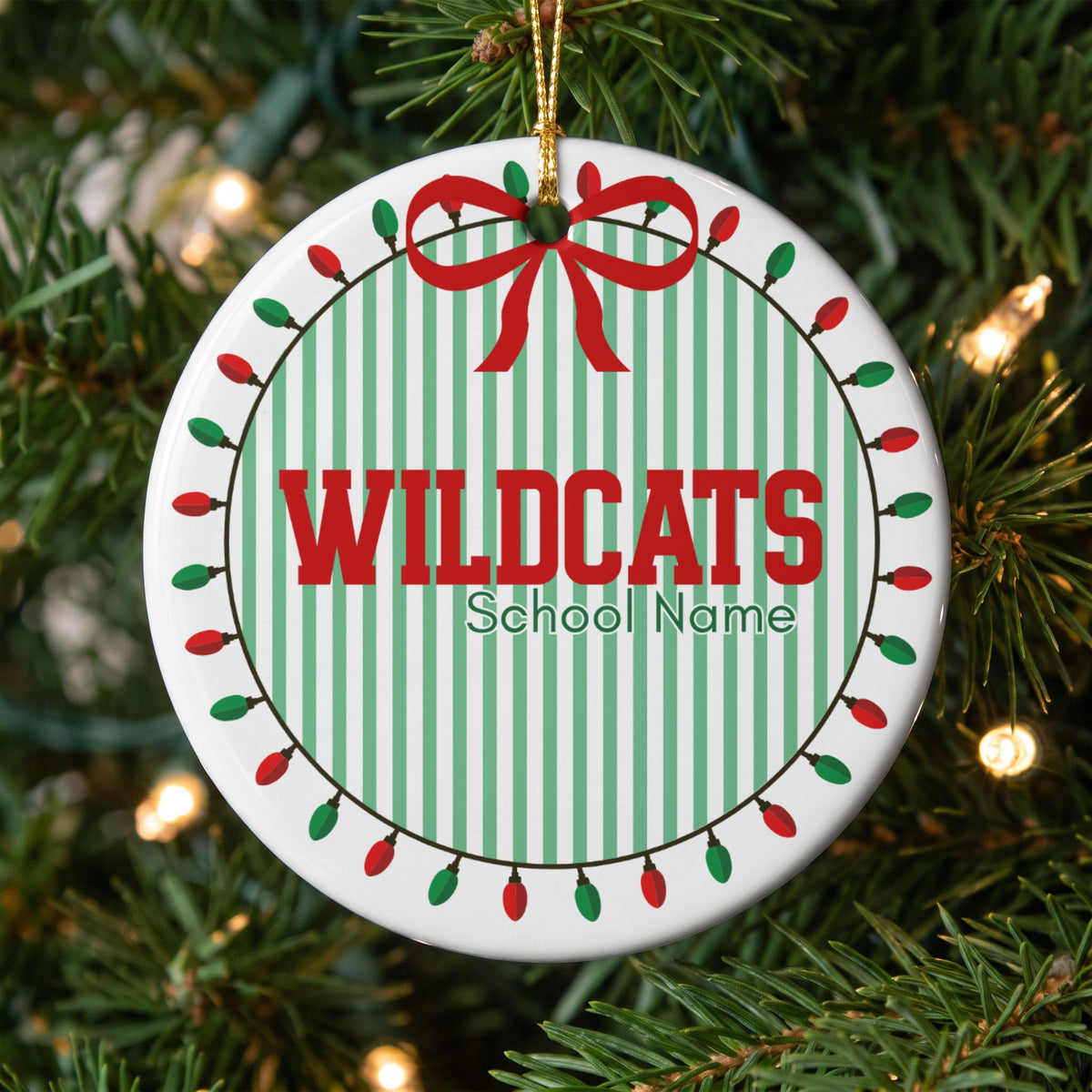 Round ornament with "WILDCATS School Name" text on striped background.