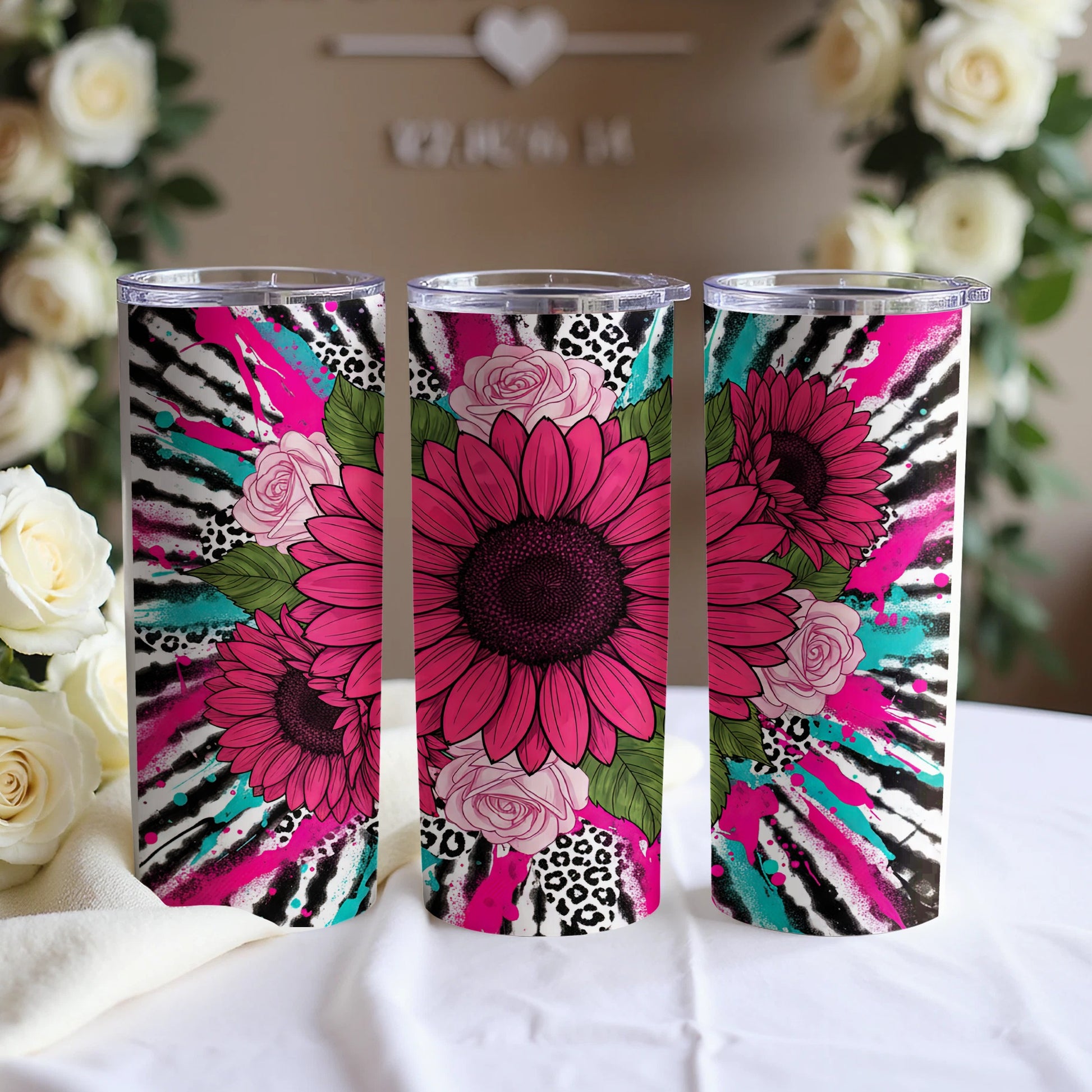 Three tumblers featuring sunflowers, zebra print, leopard print, and pink splatters.