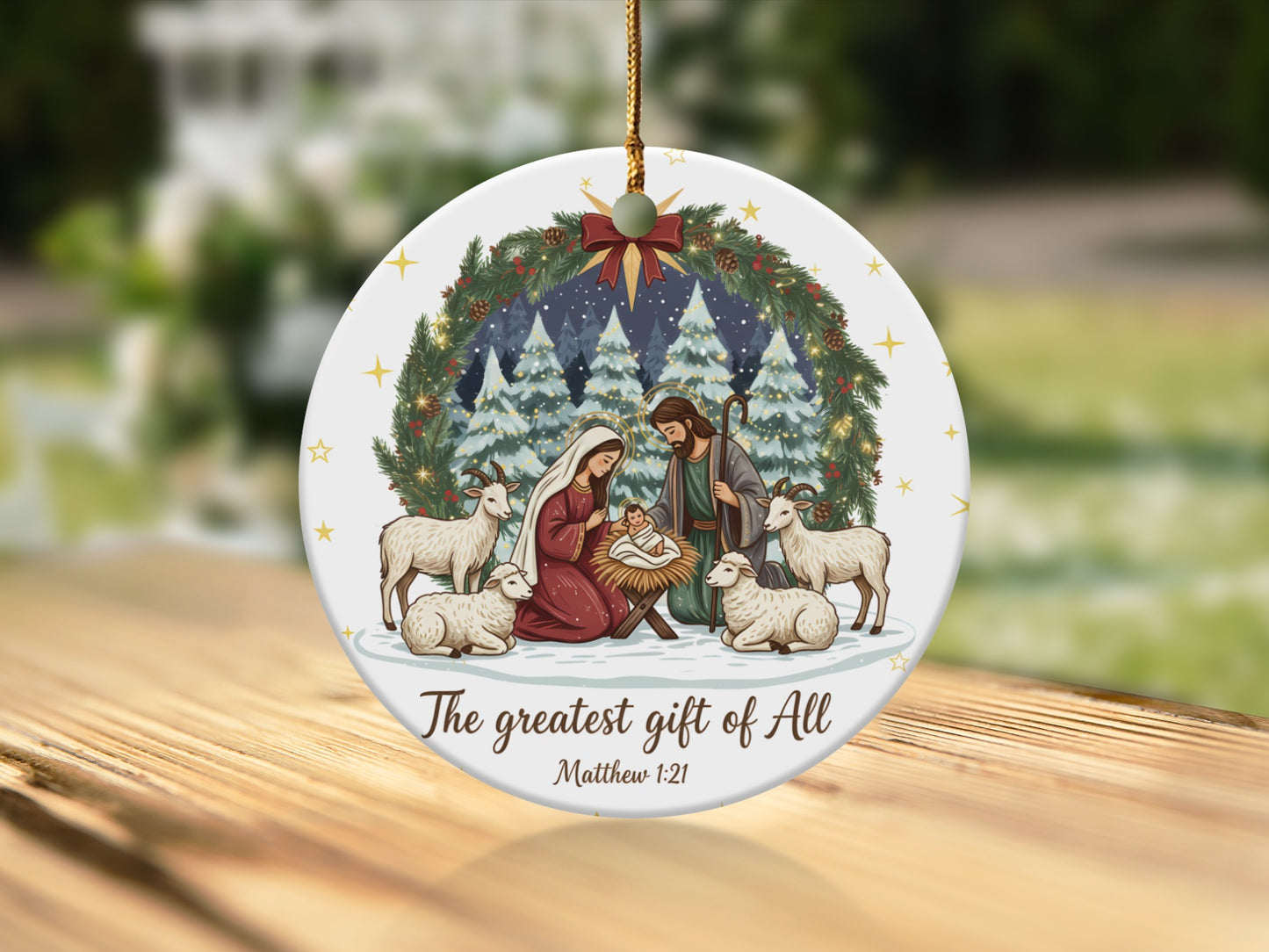 Nativity scene with Mary, Joseph, baby Jesus, sheep, goats, and pine garland. "The greatest gift of All. Matthew 1:21"
