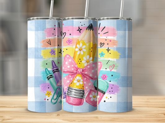 Three tumblers with a blue plaid background and crayon, pencil, and sticker graphics.