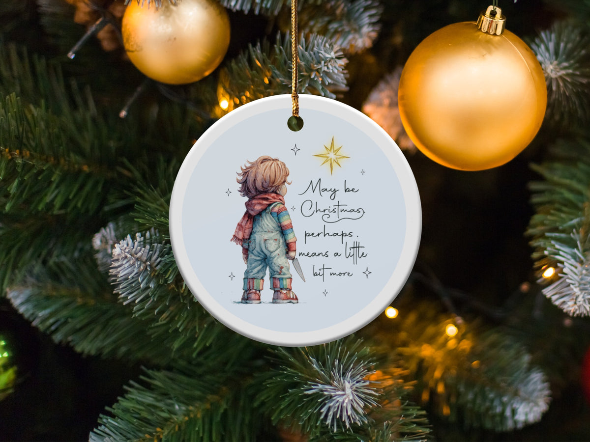 Round ornament with child holding knife and text "May be Christmas, perhaps, means a little bit more."