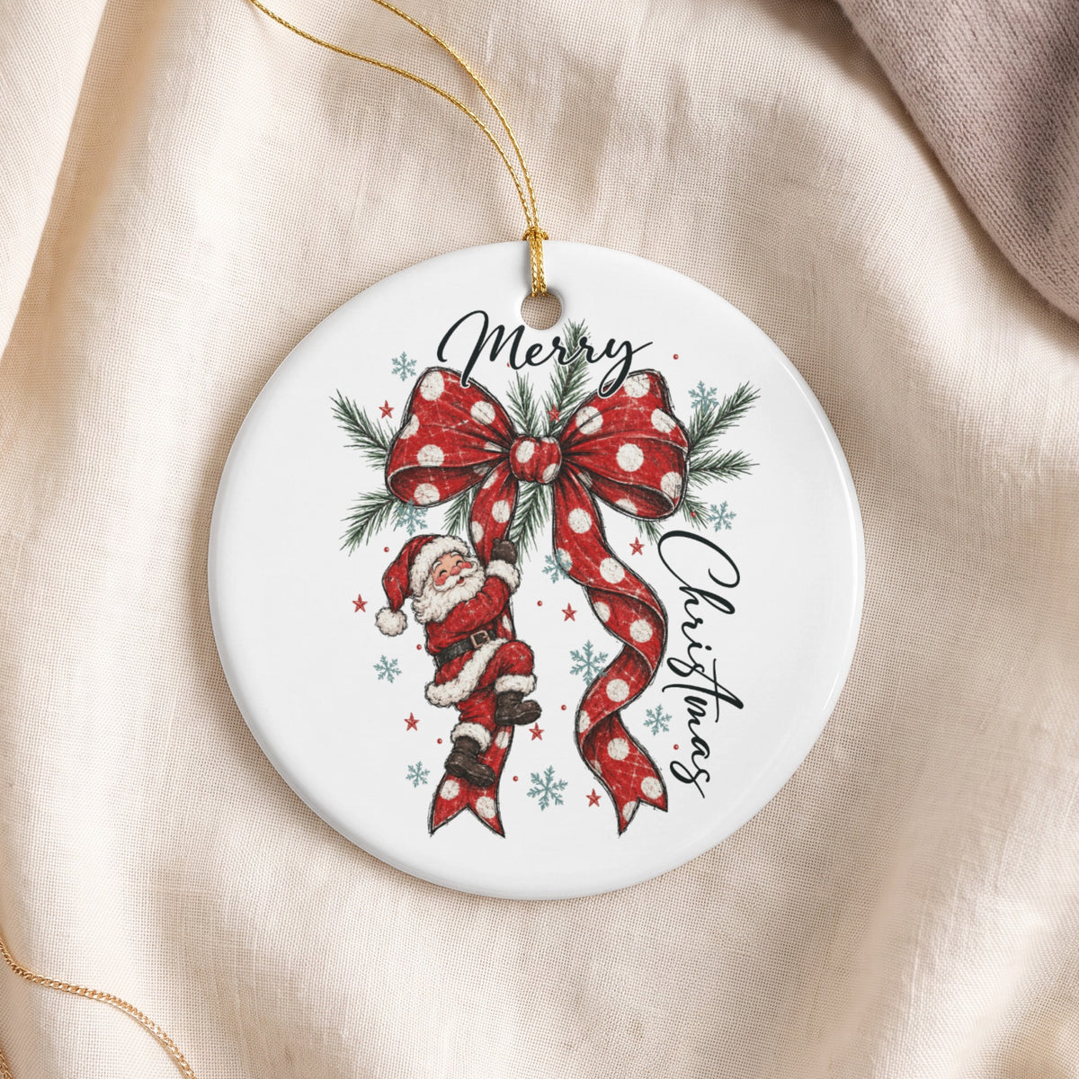 Round ornament with Santa climbing a polka dot bow, reading "Merry Christmas."