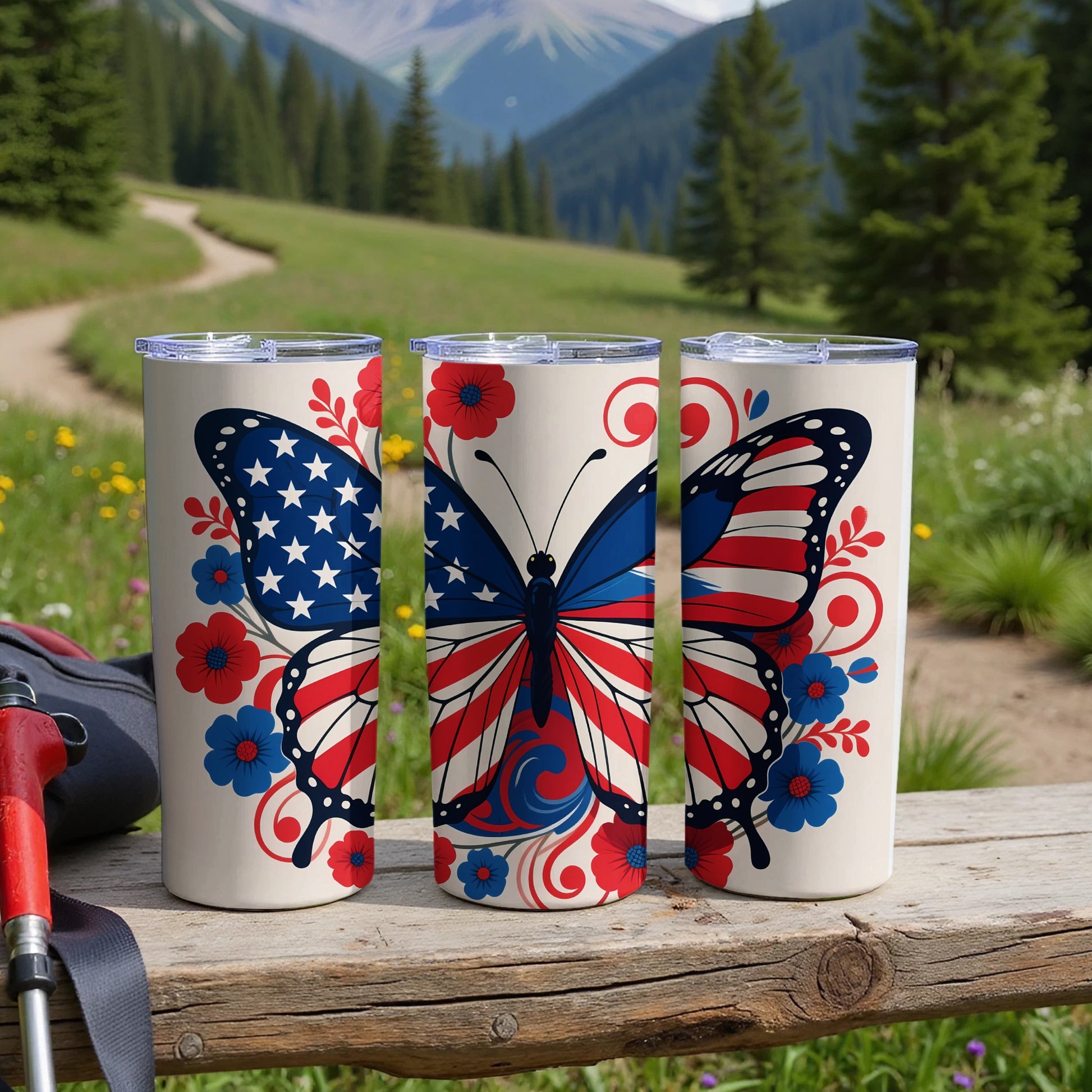 Three tumblers featuring a patriotic butterfly design with red flowers and blue accents.