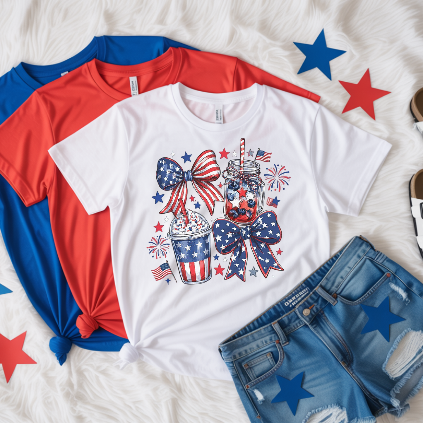 White t-shirt with patriotic design, red and blue shirts, and denim shorts on a white background with star decorations.