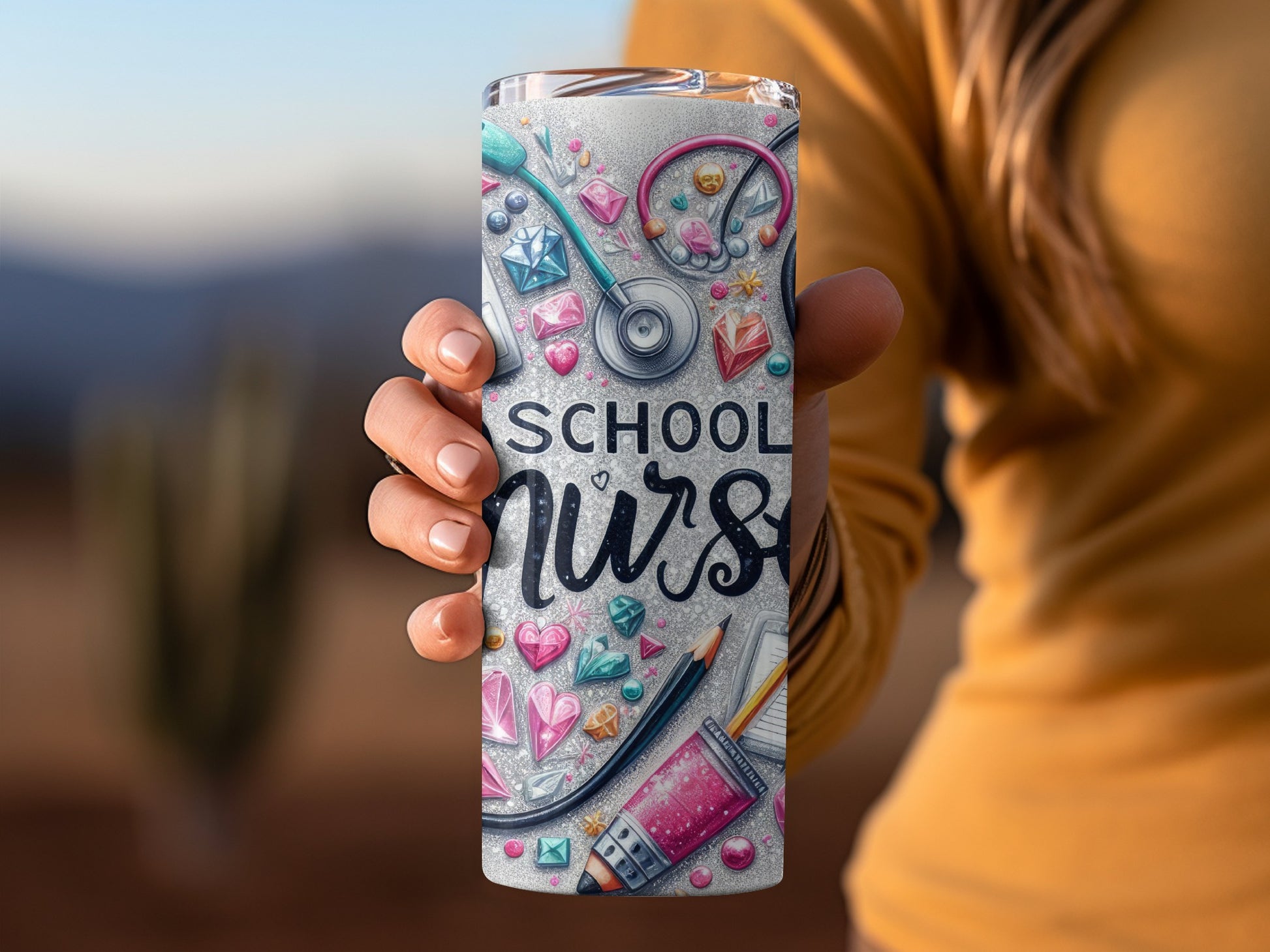 Tumbler with "School Nurse" text surrounded by medical and heart icons.