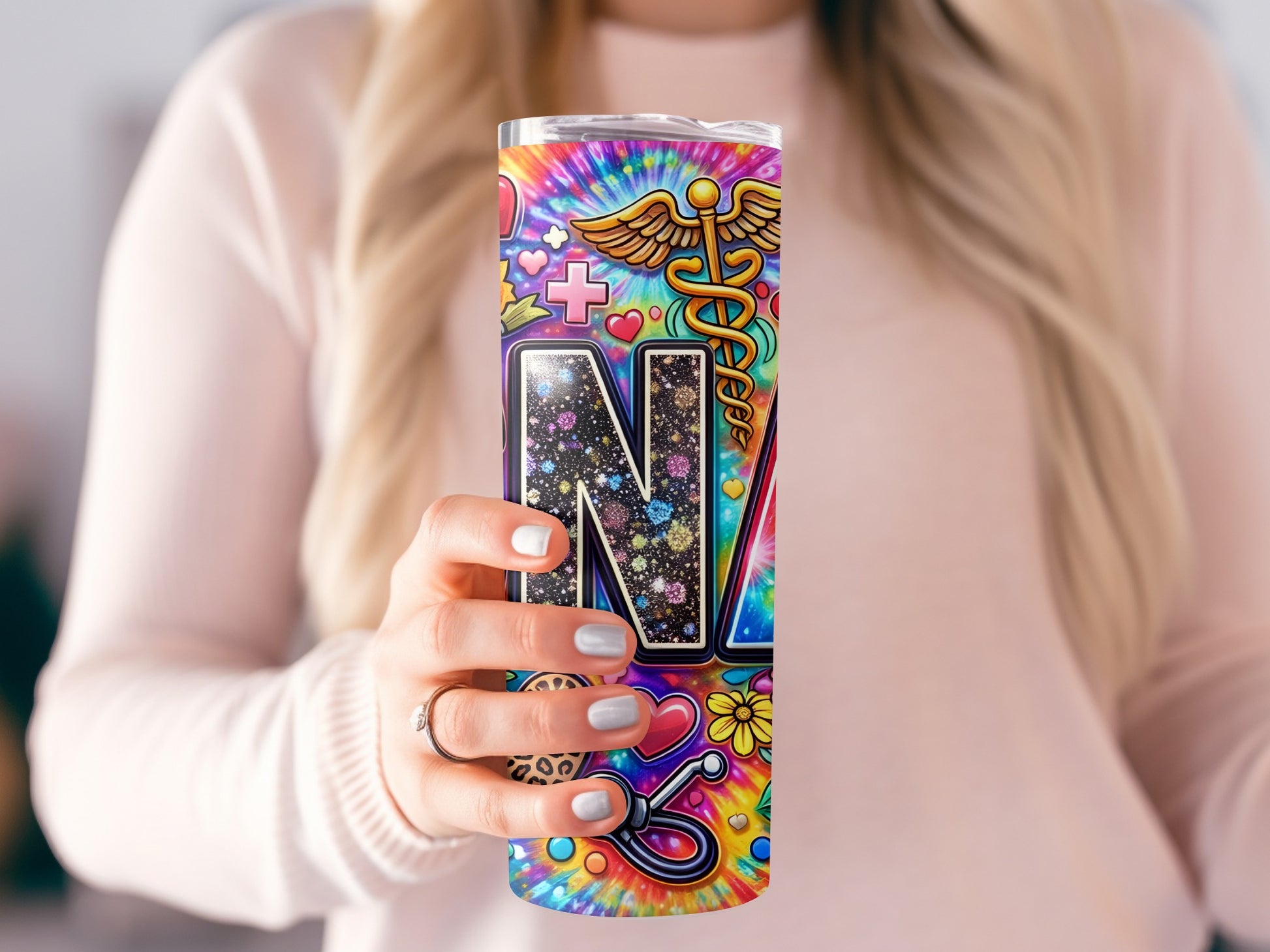Nurse tumbler with colorful tie-dye and medical symbols.