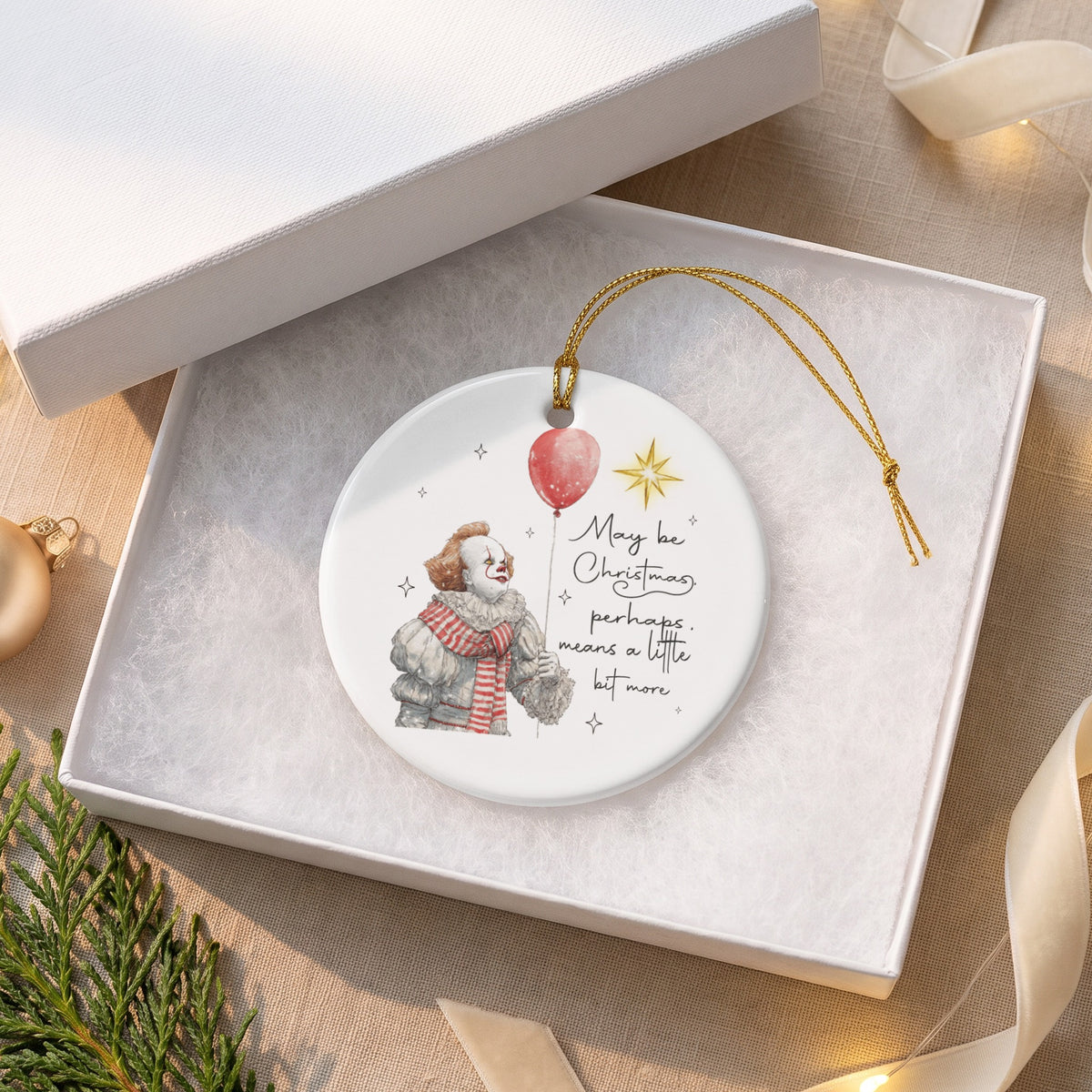 Ornament with Pennywise, balloon, and text "May be Christmas, perhaps, means a little bit more".
