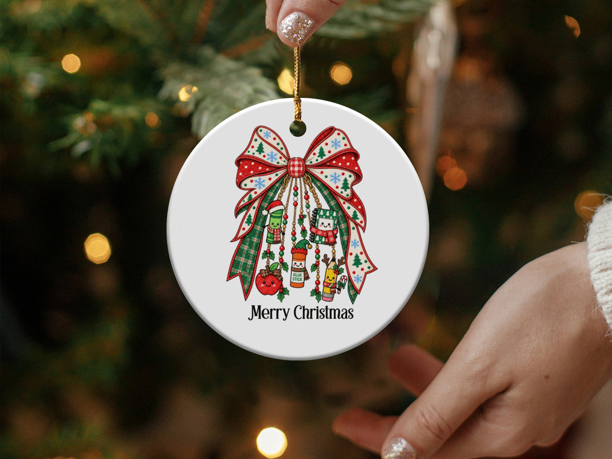 Round Christmas ornament with festive bow, school supplies, and "Merry Christmas" text.