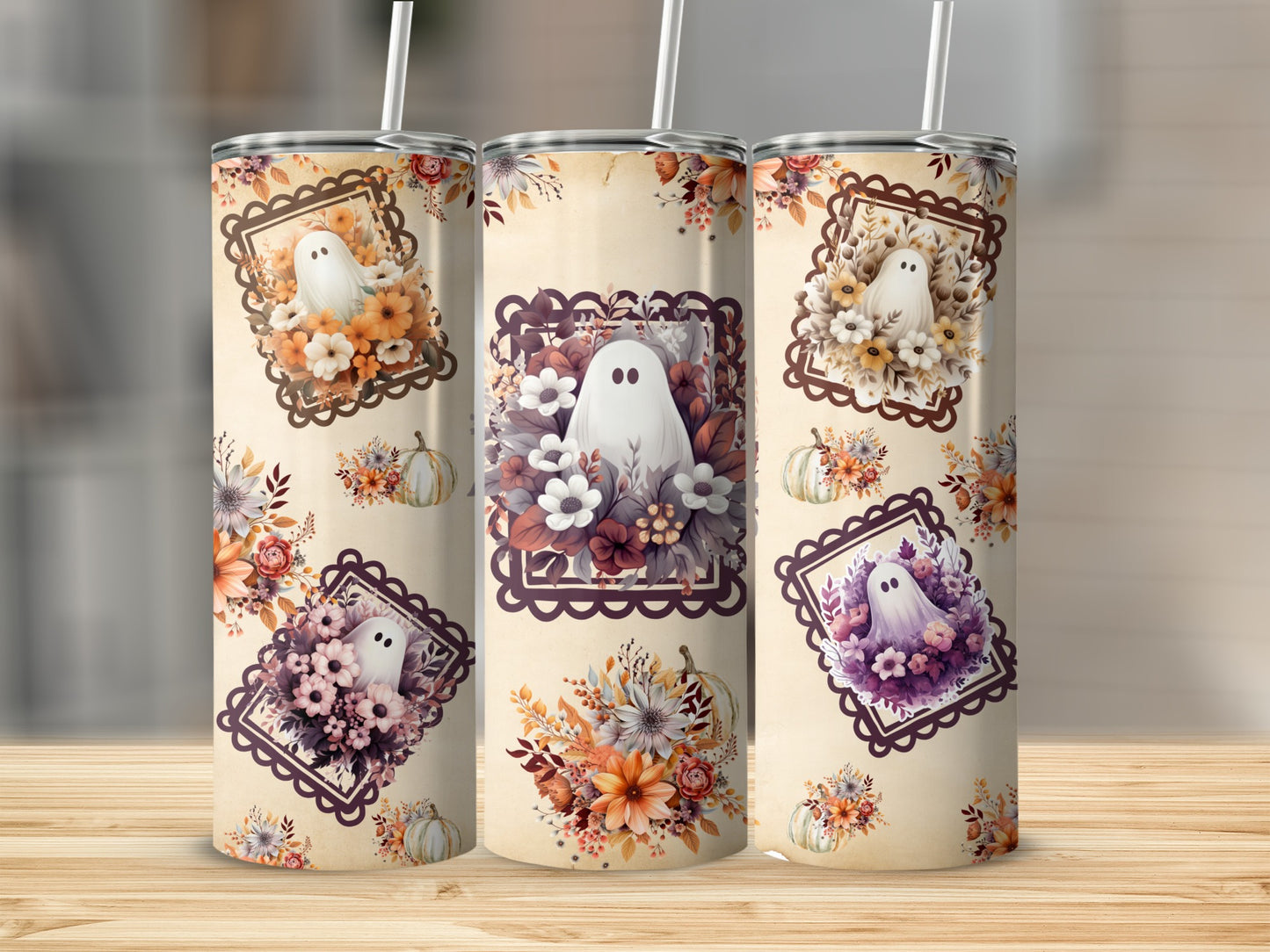 Three tumblers with ghost and floral designs, each featuring a white ghost within a patterned frame.