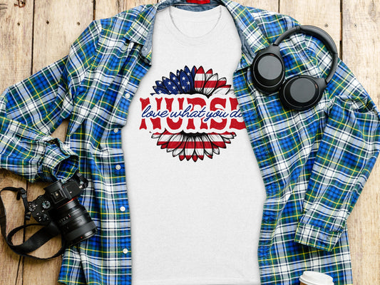 White t-shirt with "love what you do" sunflower design and plaid shirt.