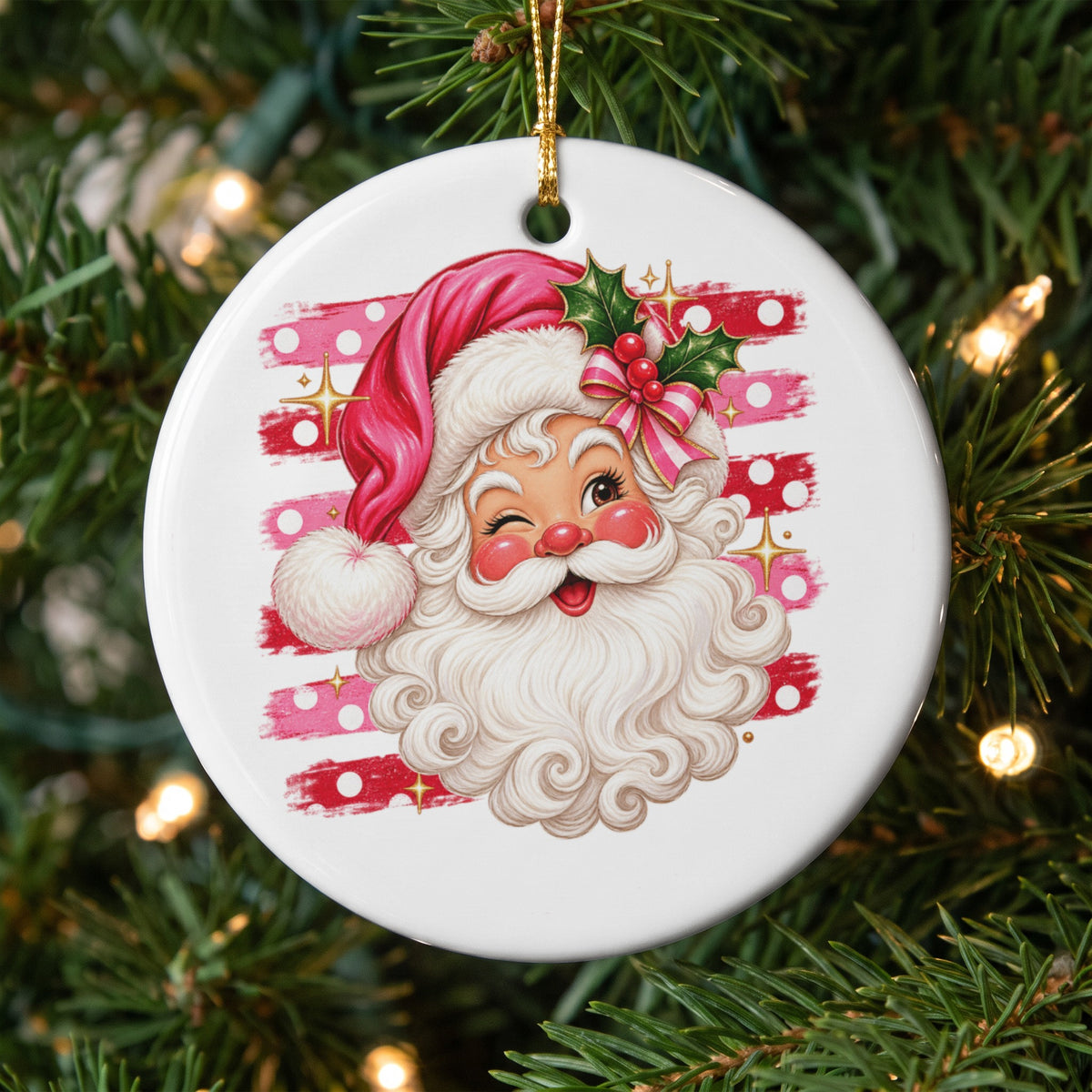 Santa Claus head ornament with pink stripes and white polka dots.