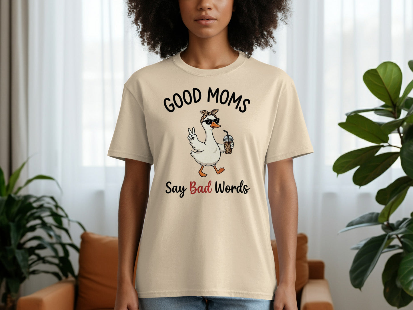 Beige t-shirt with "Good Moms Say Bad Words" text and a cartoon duck.