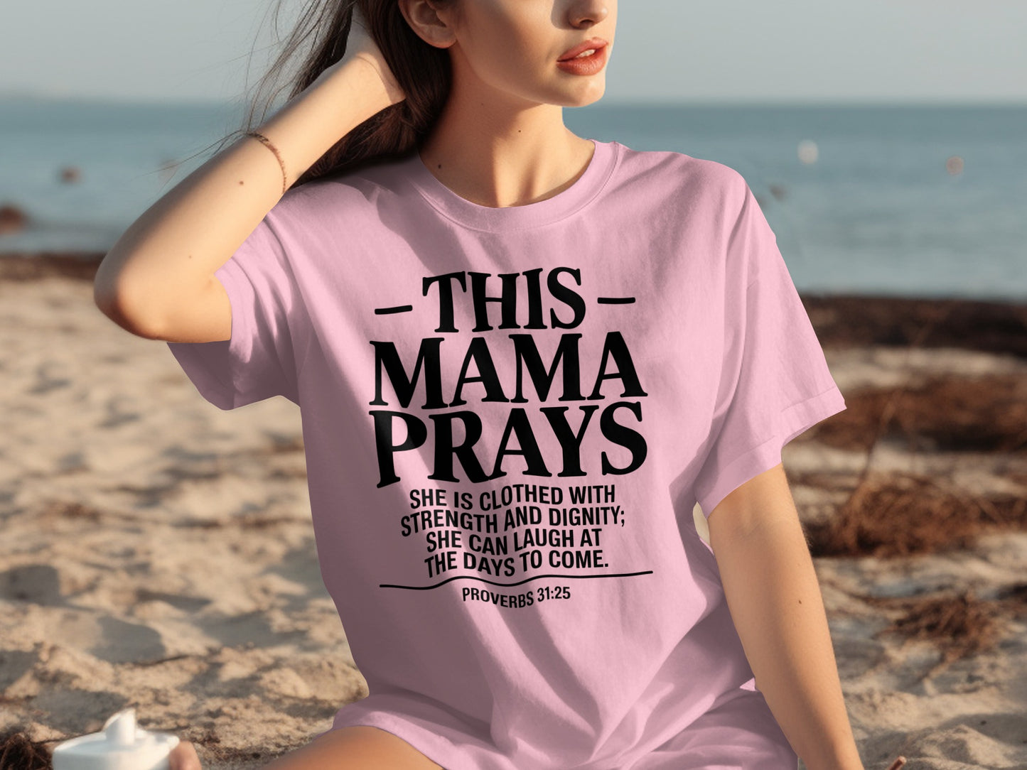 Pink t-shirt with text "This Mama Prays" and Proverbs 31:25.
