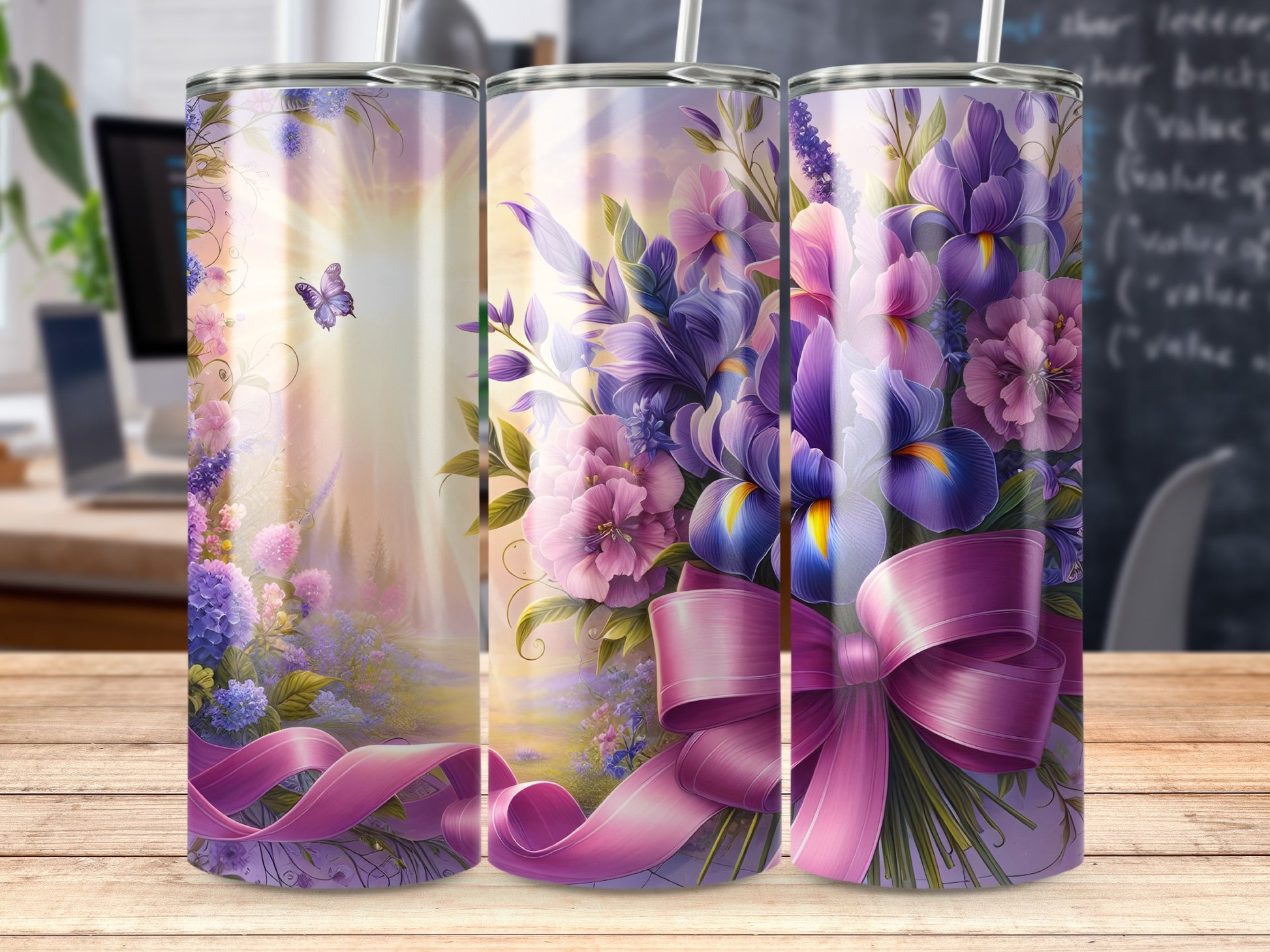 Floral arrangement with purple and pink flowers, green leaves, and a pink bow.