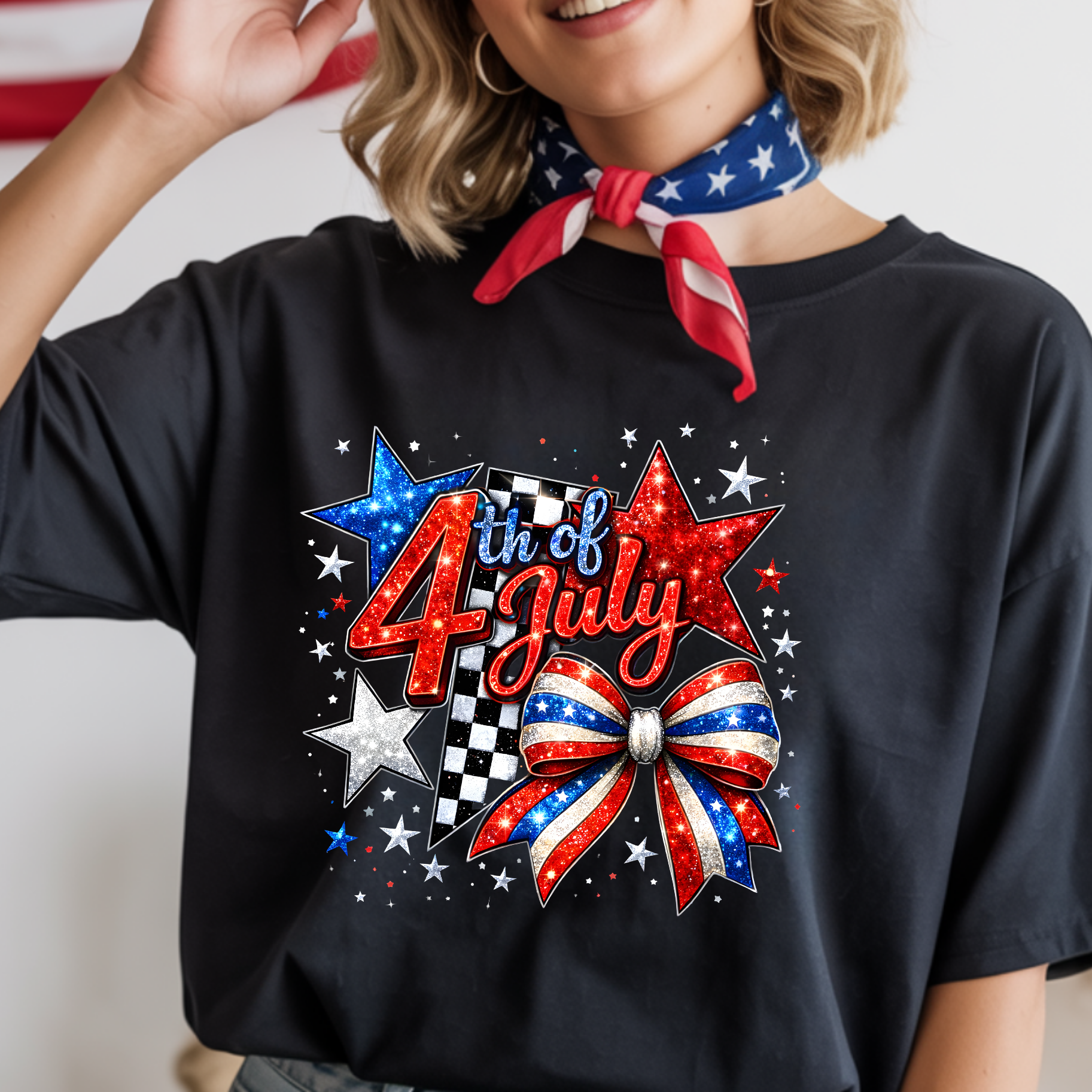 Person wearing a black t-shirt with '4th of July' design and a red, white, and blue bow.