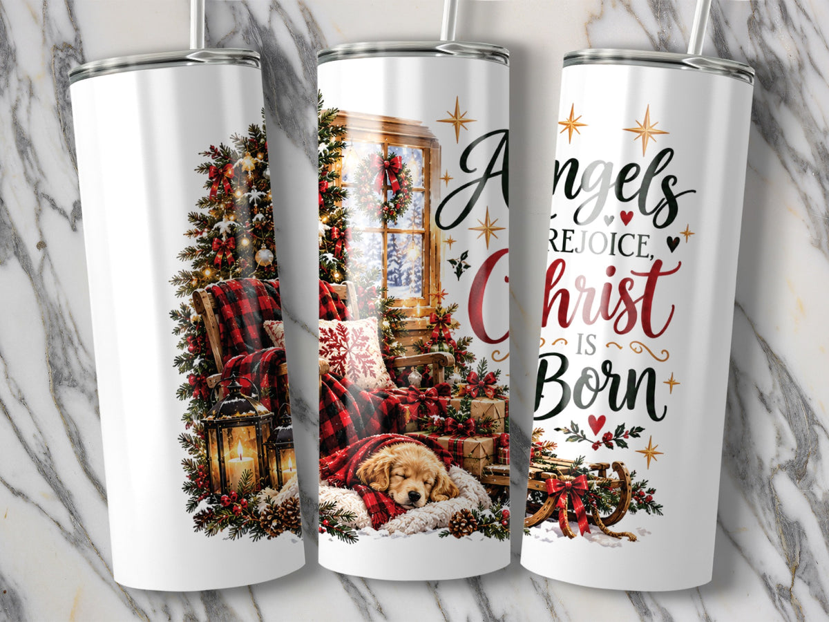 Three white tumblers display a Christmas design with a sleeping puppy, a decorated tree, and text reading Angels Rejoice, Christ Is Born.