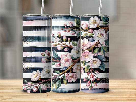 Three tumblers with black and white stripes and floral branch designs.