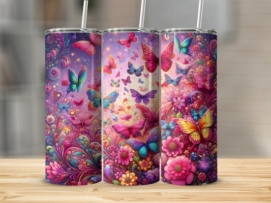 Three tumblers with colorful butterfly and floral designs.