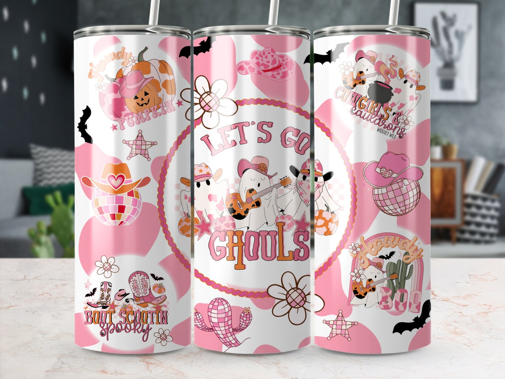 Pink and white tumblers with Halloween cowgirl ghost designs, pumpkins, boots, and text.