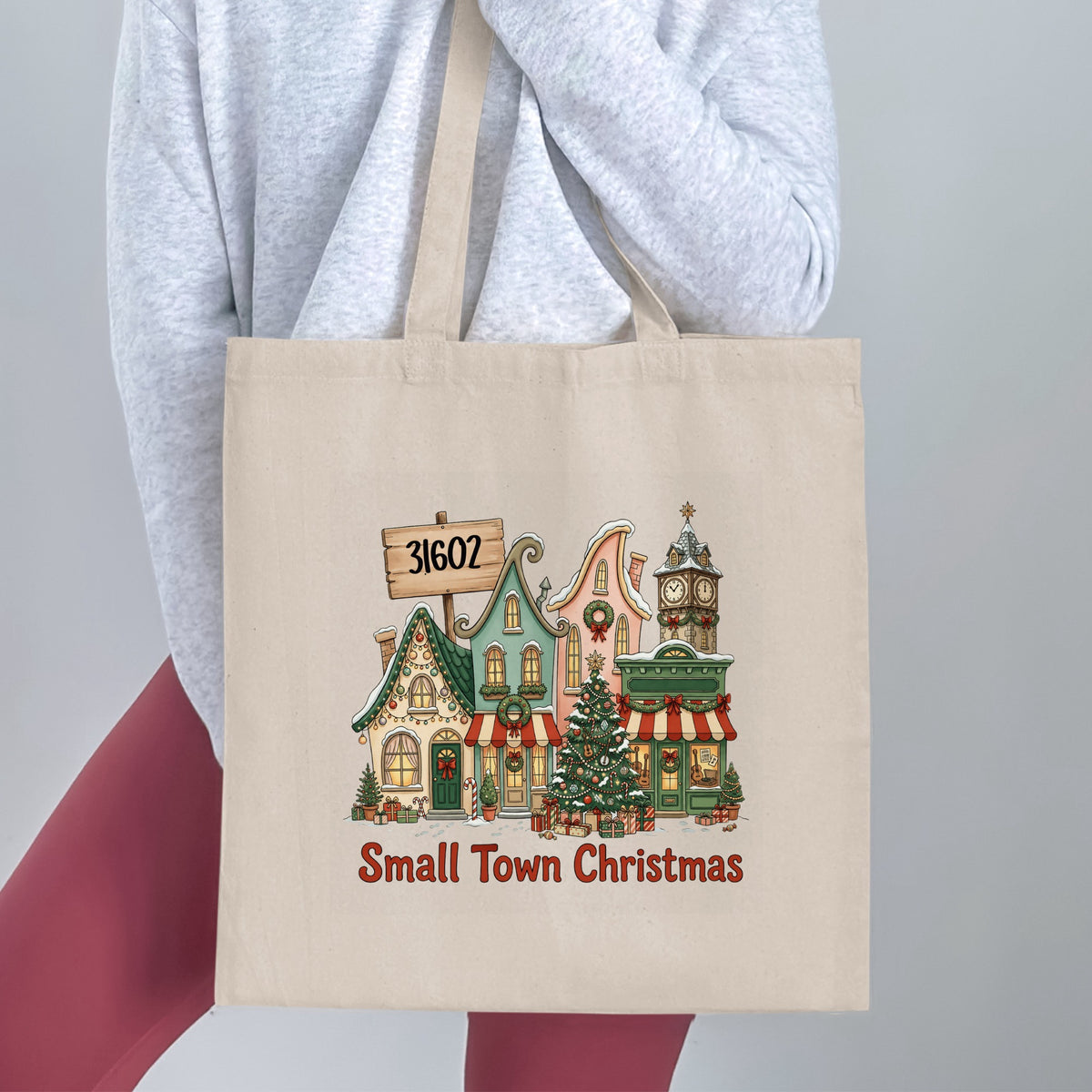 Tote bag with "Small Town Christmas" and street scene, featuring zip code 31602.