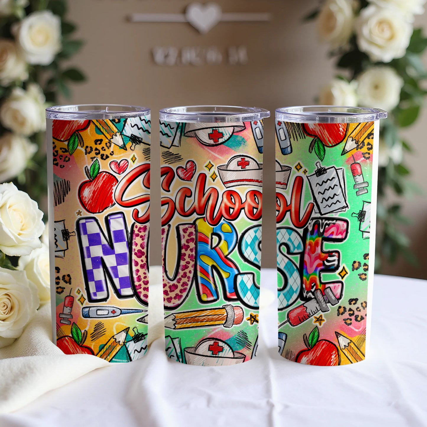 Three tumblers decorated with colorful school nurse themed graphics and text.