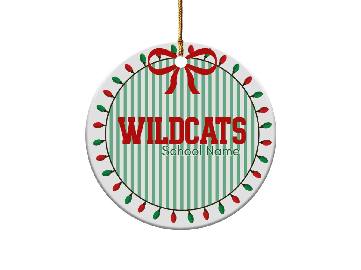 Round ornament with "WILDCATS School Name" text, green stripes, and Christmas lights.