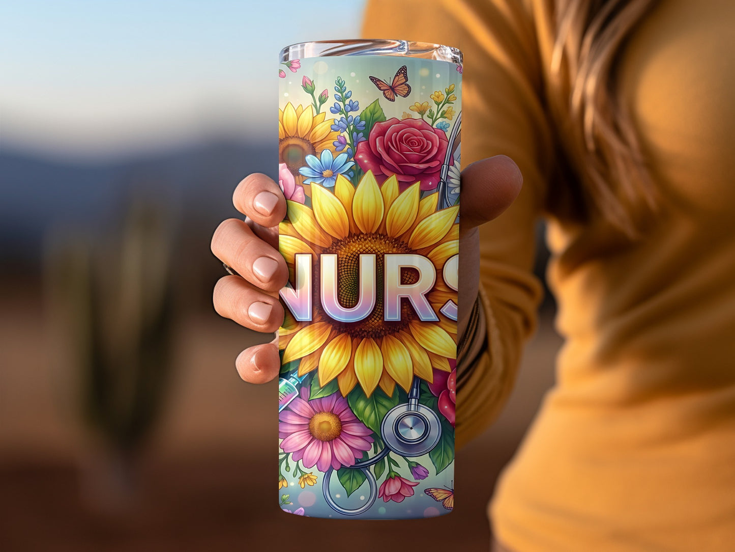 Sunflower and floral design with "NURS" lettering on a tumbler.