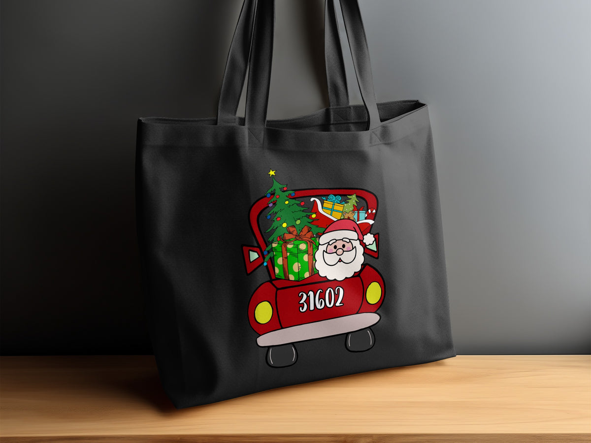 Black tote bag with Santa in a red truck filled with Christmas gifts.
