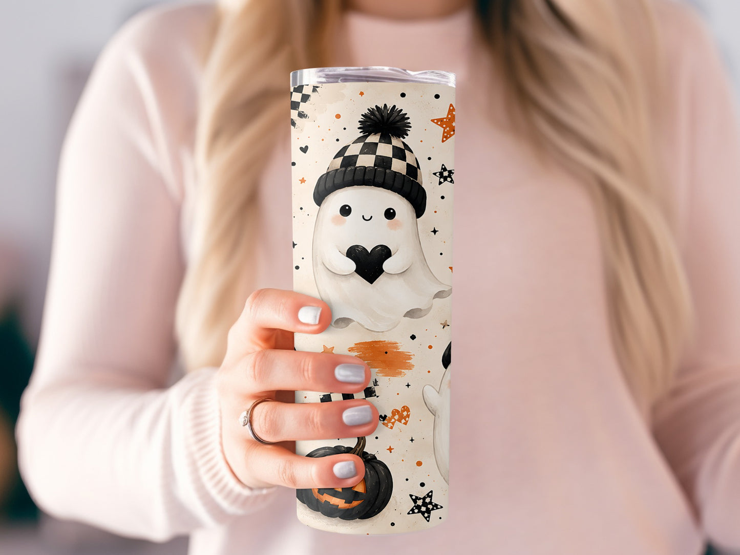 Tumbler with cute Halloween ghosts, pumpkins, stars, and hearts pattern.
