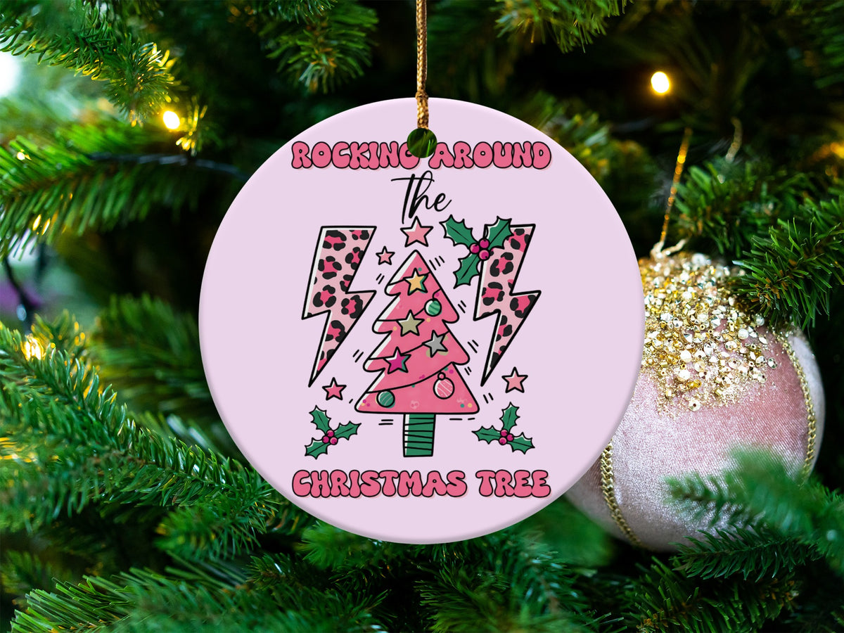 Pink round ornament with "Rocking Around the Christmas Tree" text and festive tree design.