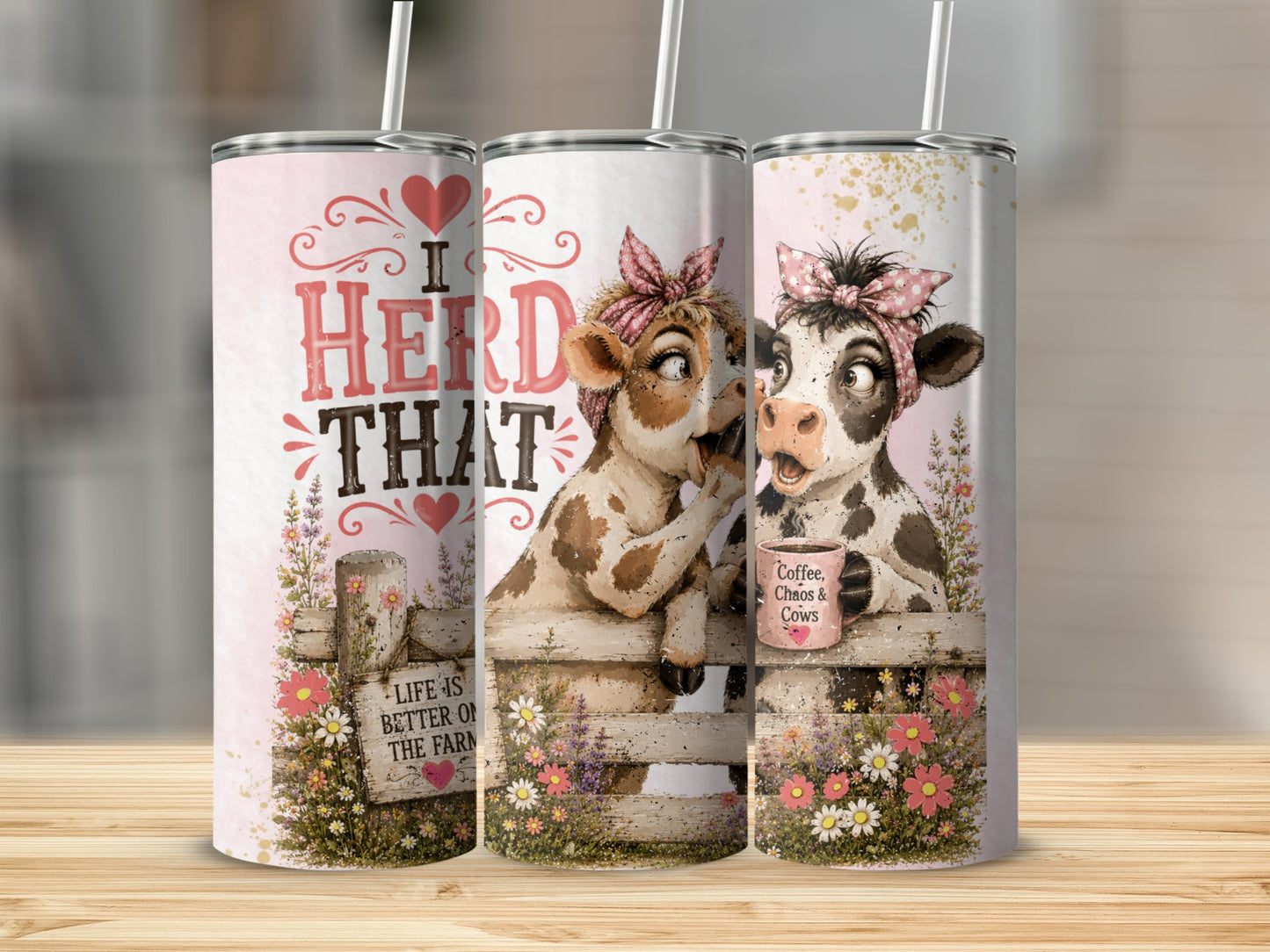Three tumblers with cows, one with "I Herd That" text and farm and flower designs.