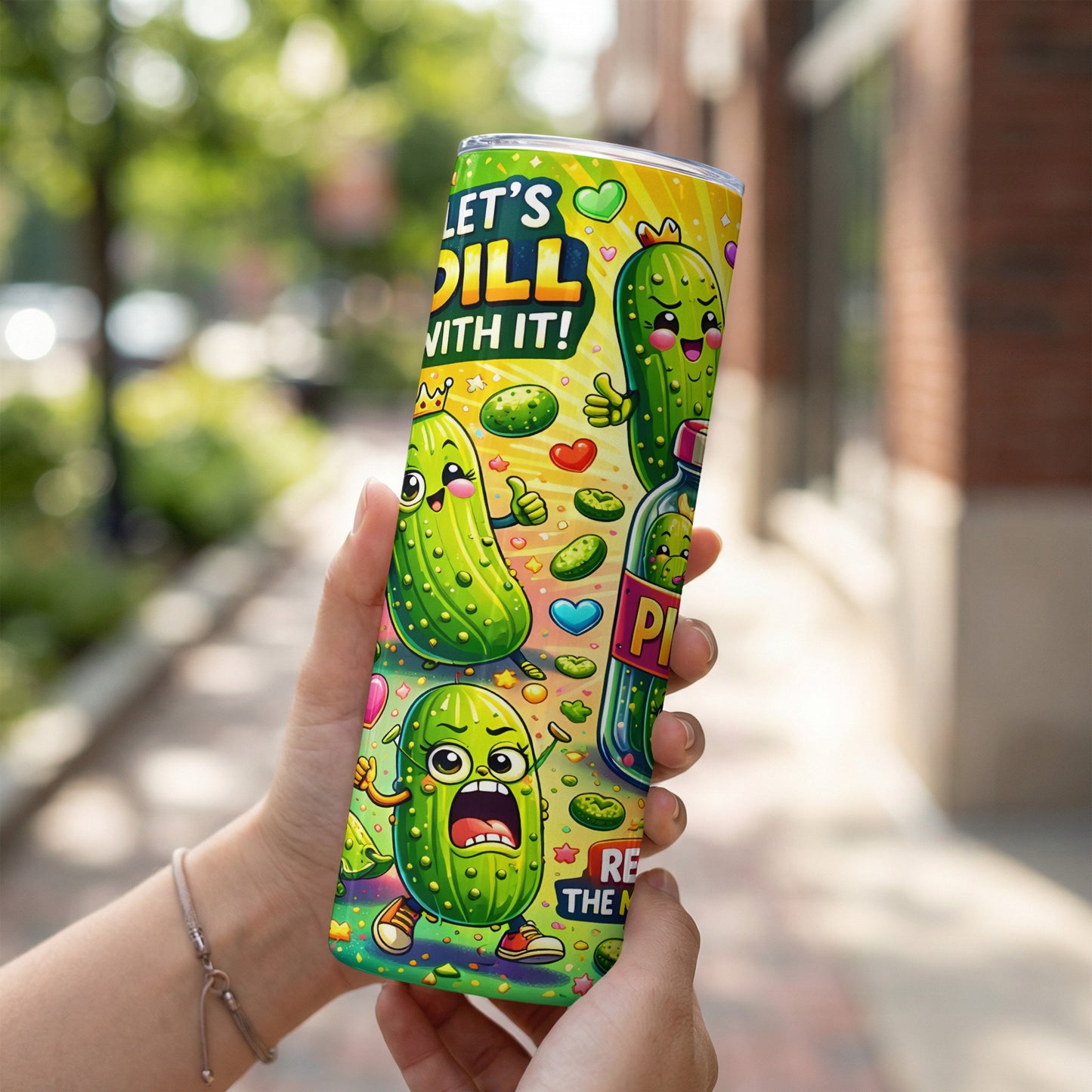 Tumbler with cartoon pickles, one holding a heart, the other with the text "LET'S DILL WITH IT!".