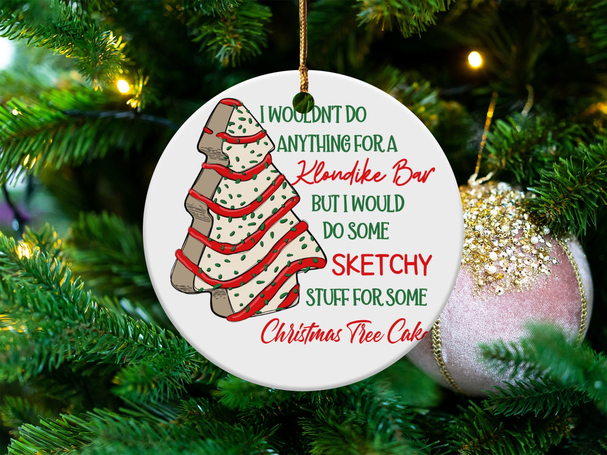 Round ornament with a cookie drawing and text about Klondike Bar and Christmas Tree Cake.