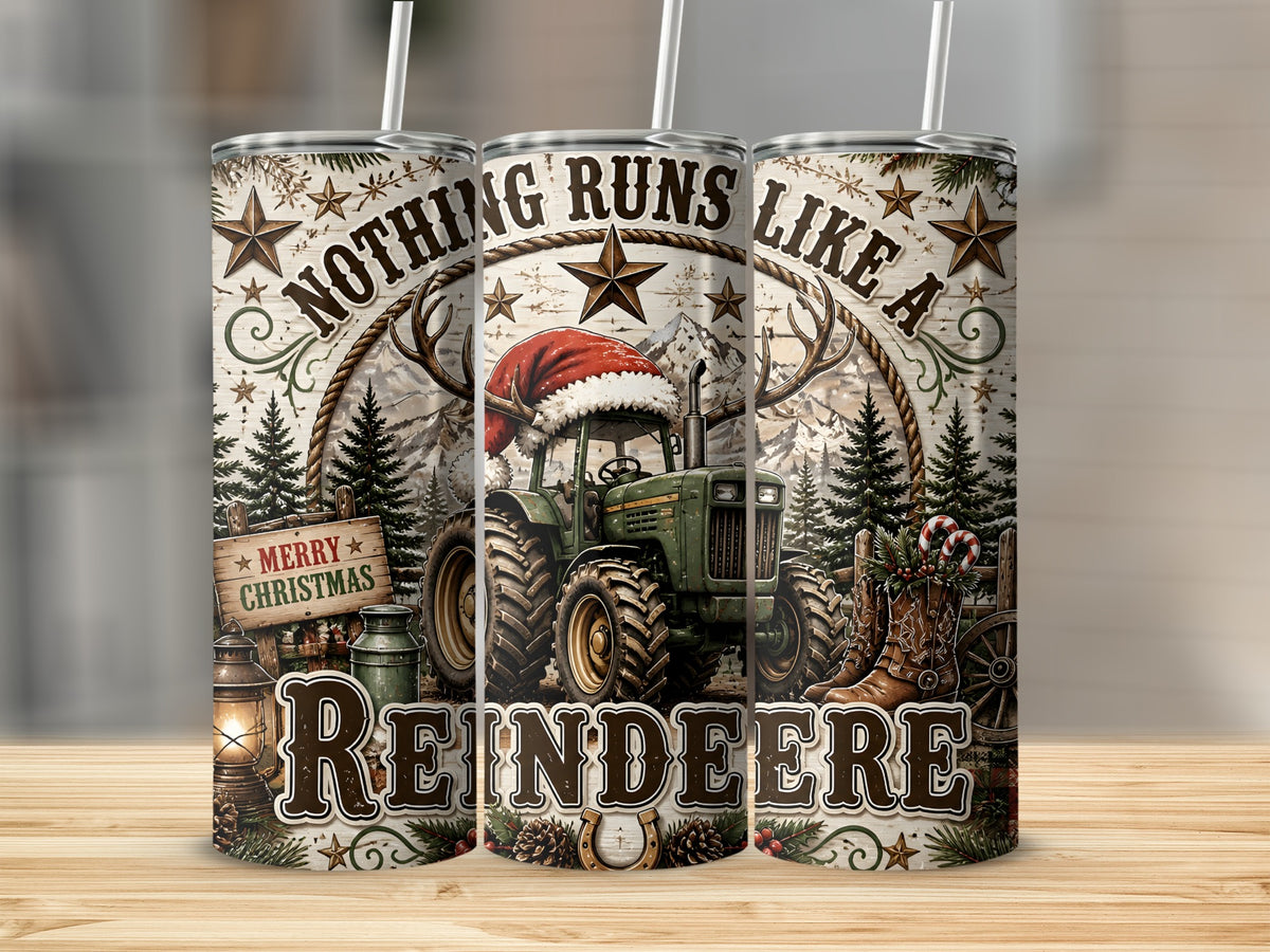 Three metal tumblers with straws display a Christmas tractor design and the text Nothing Runs Like A Reindeer.