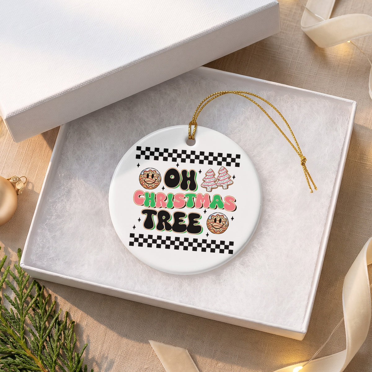 White ceramic ornament with "OH CHRISTMAS TREE" text and gingerbread cookies.