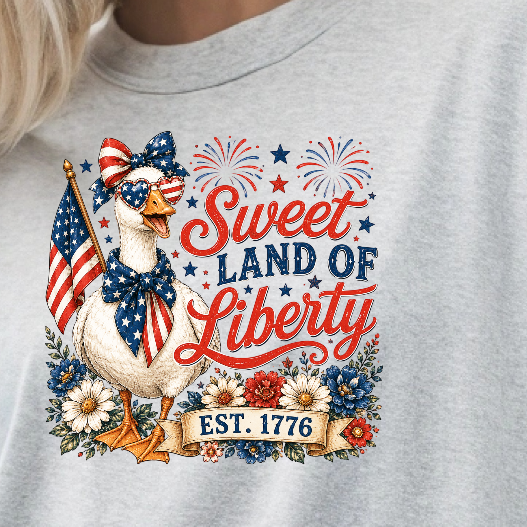 Gray t-shirt with a patriotic design featuring a duck, American flag, and 'Sweet Land of Liberty' text.