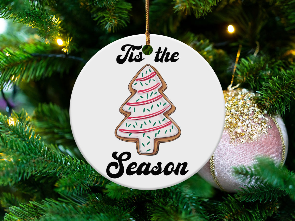 White round ornament with a gingerbread tree cookie and "Tis the Season" text.