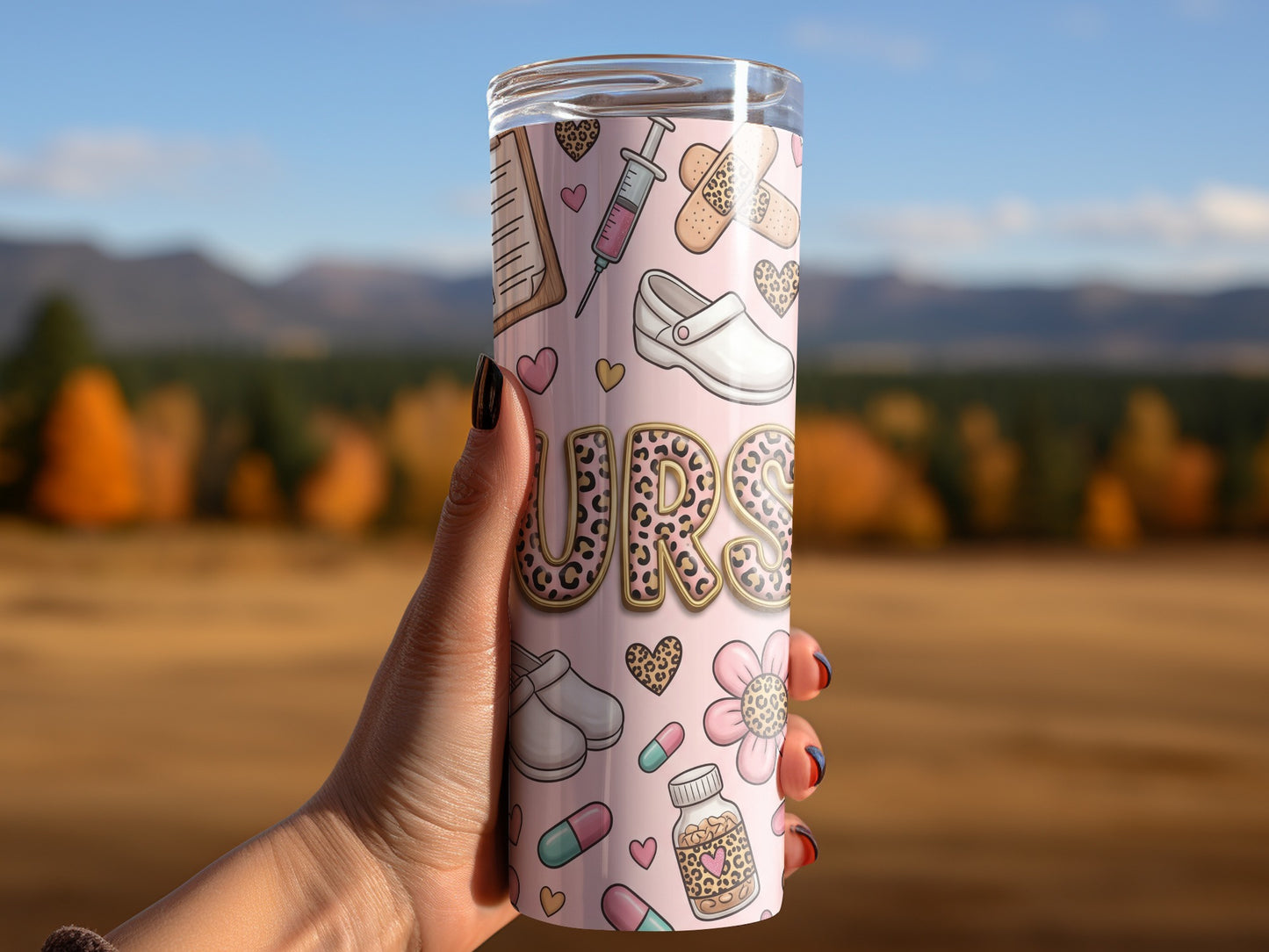 Tumbler with medical icons and leopard print lettering, held by a hand.