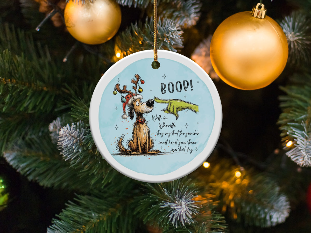 Dog with Grinch finger saying "BOOP!" and text about the Grinch's heart.