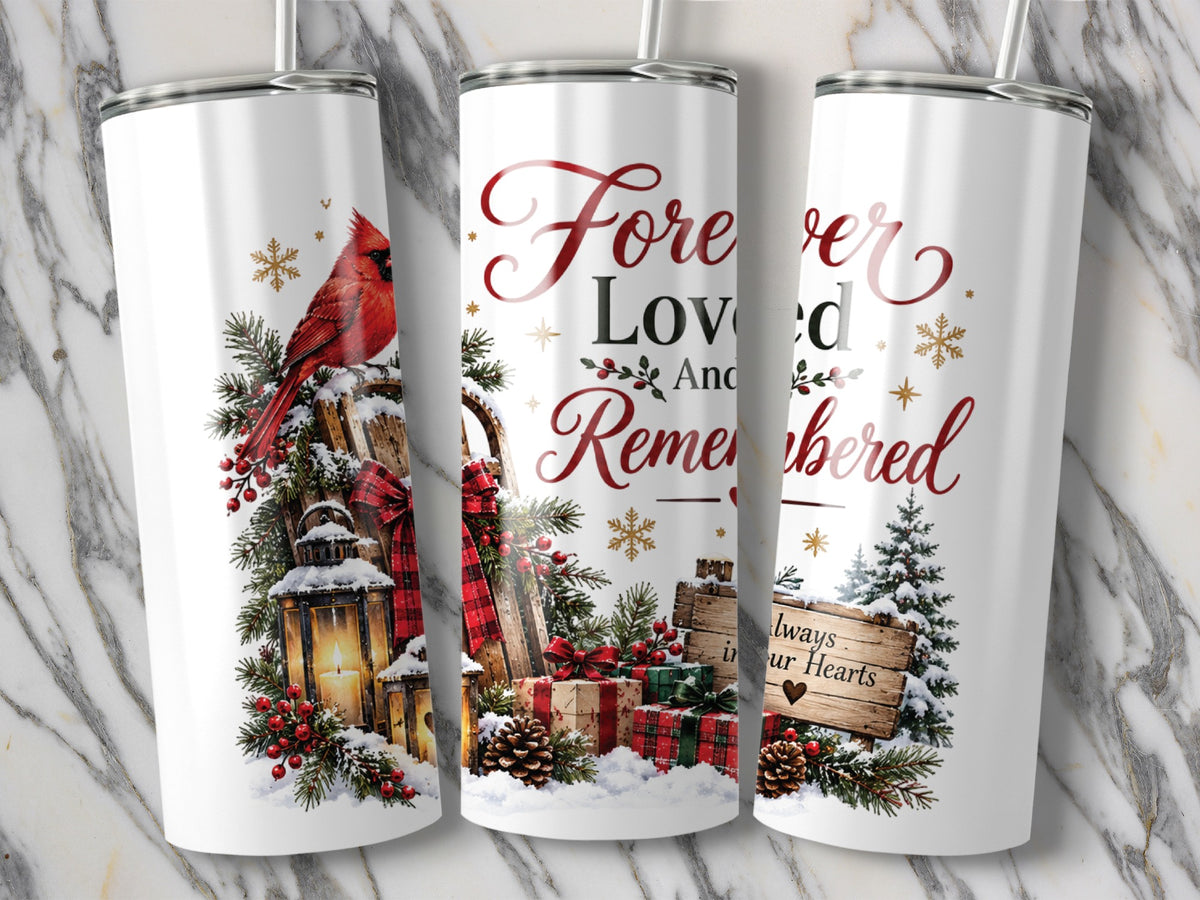 Three white tumblers feature a memorial Christmas design with a cardinal, lantern, wrapped gifts, and text reading Forever Loved And Remembered.