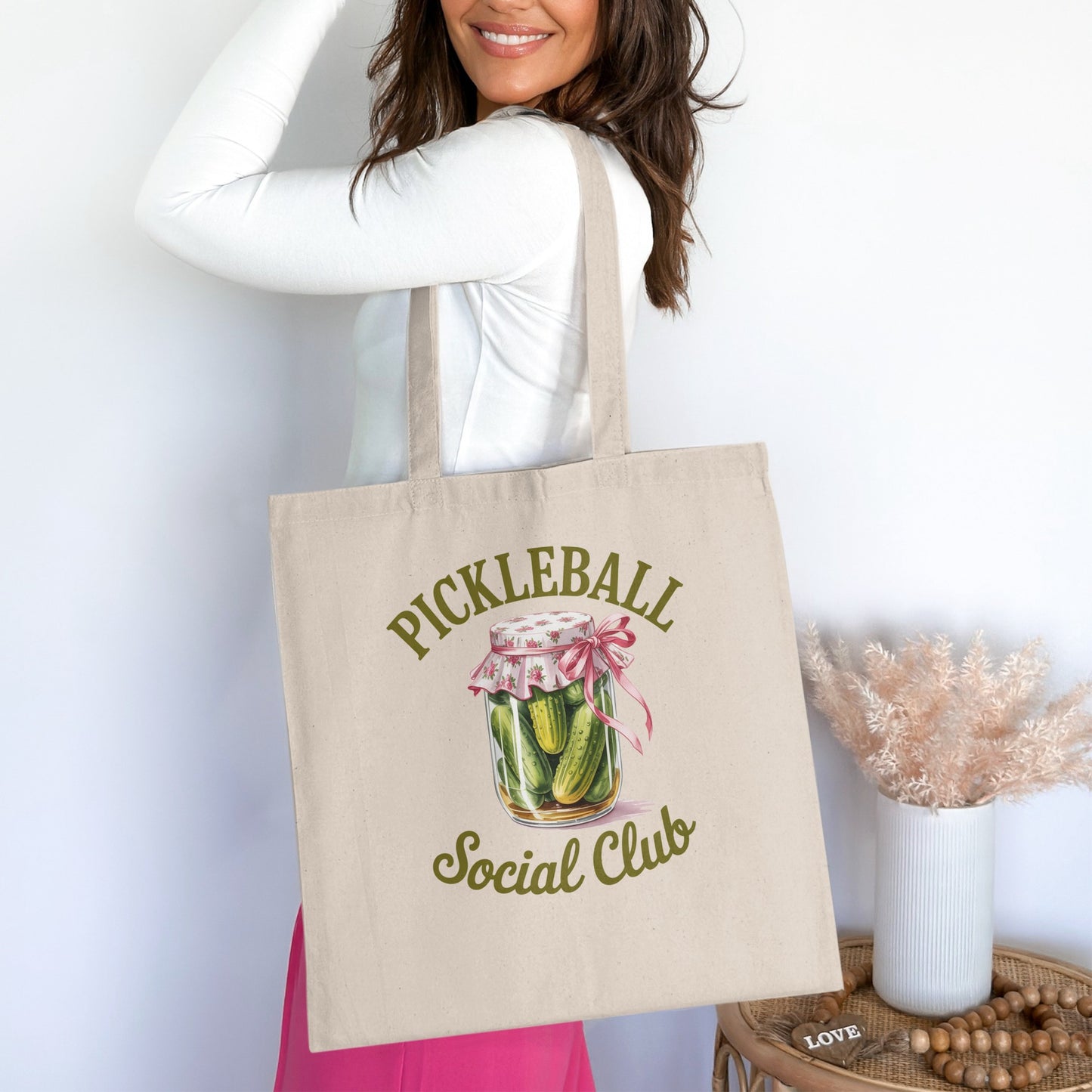 Tote bag with pickle jar and "Pickleball Social Club" text.