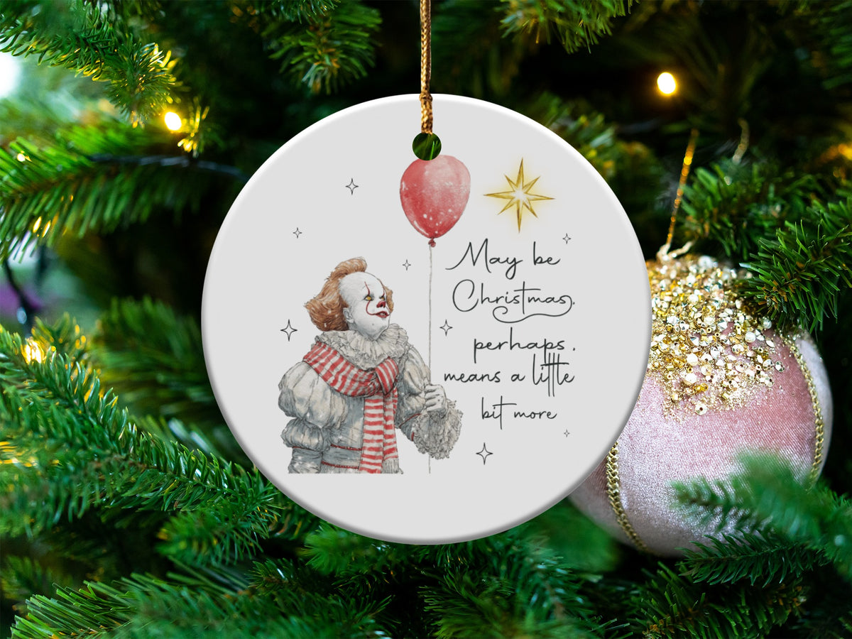 Round ornament with Pennywise and "May be Christmas, perhaps, means a little bit more".