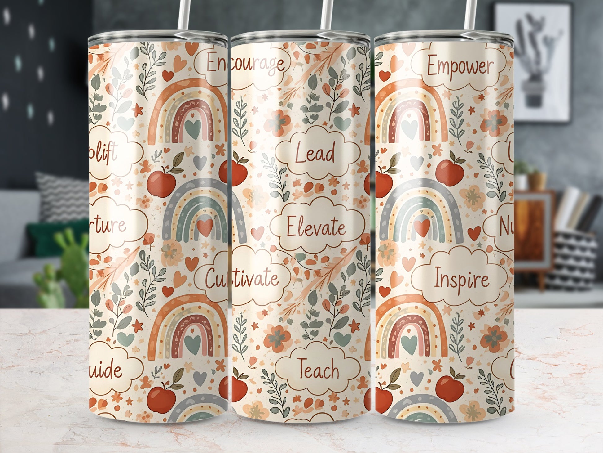 Three tumblers with a pastel rainbow and floral pattern, featuring words like Lead, Cultivate, Teach, Inspire.