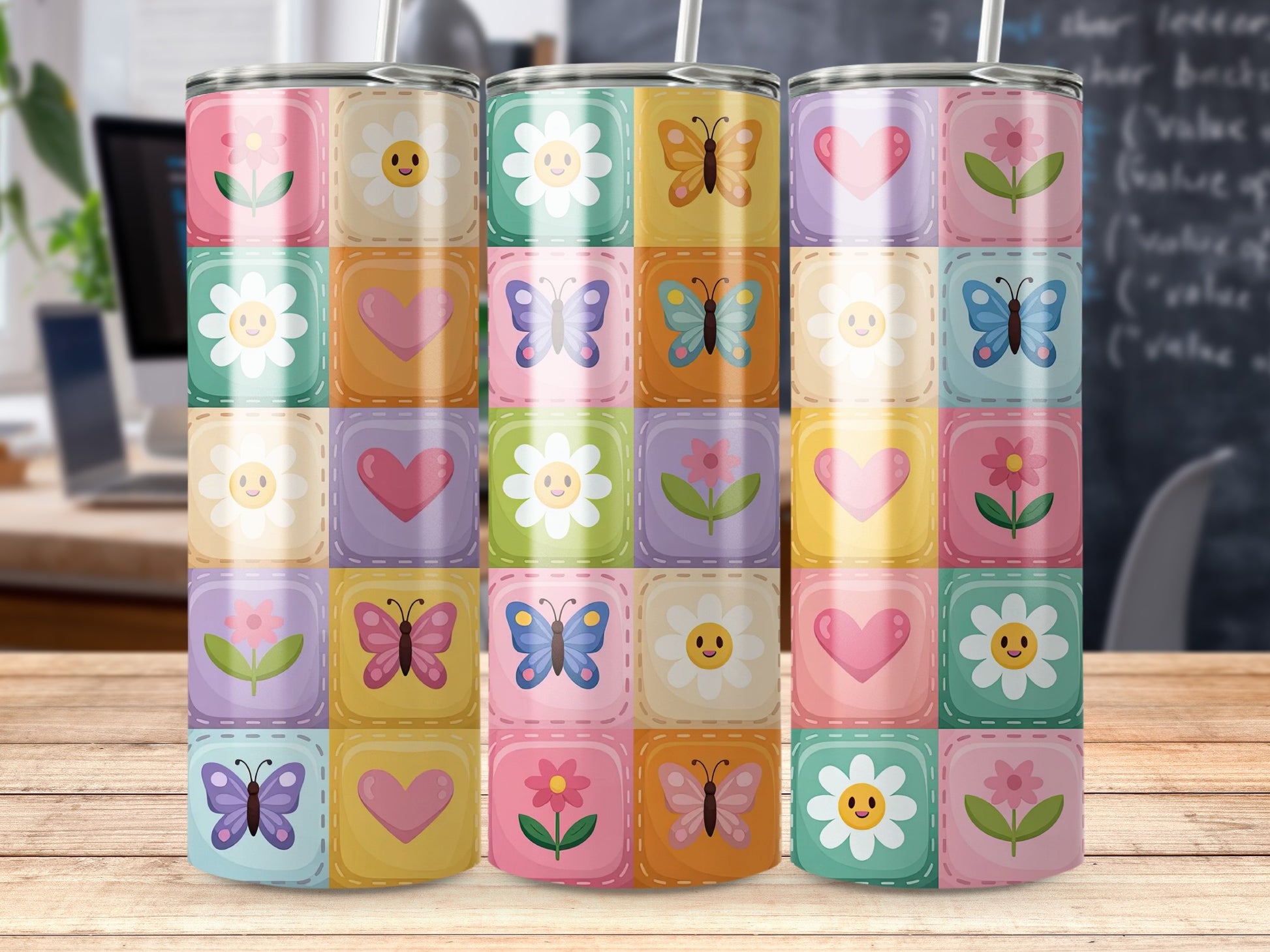 Floral and butterfly pattern on a tumbler with pastel squares.