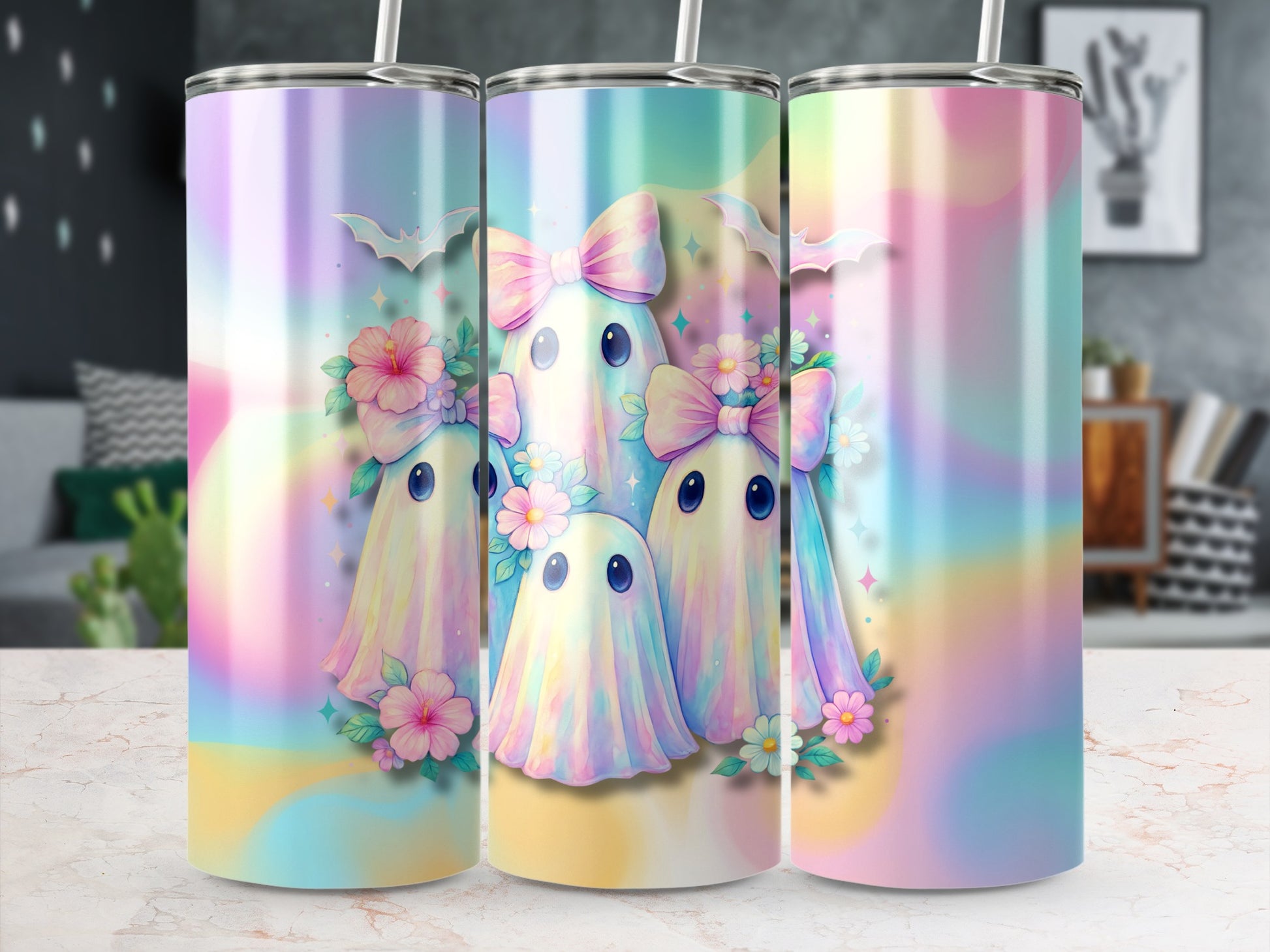 Three tumblers featuring pastel ghosts, bows, bats, and flowers.