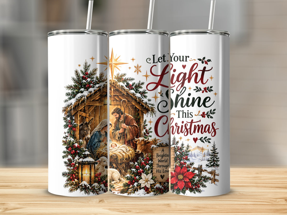 Three tall white tumblers display a Christmas nativity scene with text reading Let Your Light Shine This Christmas.