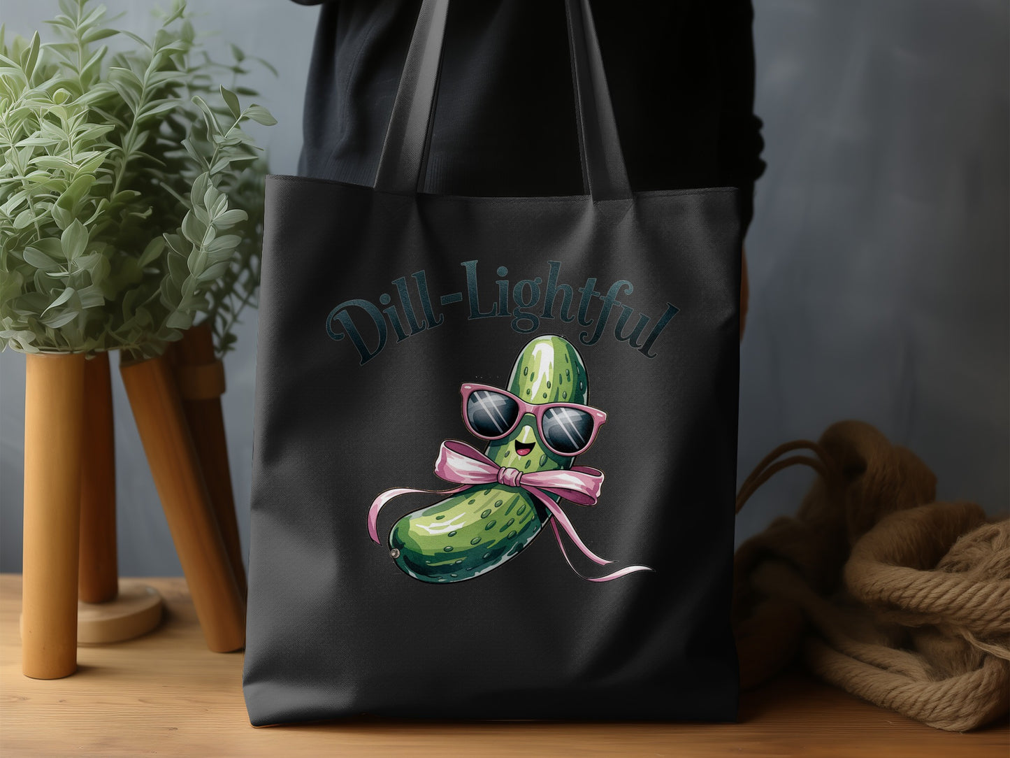 Tote bag with cartoon dill pickle wearing sunglasses and bow, "Dill-lightful" text.