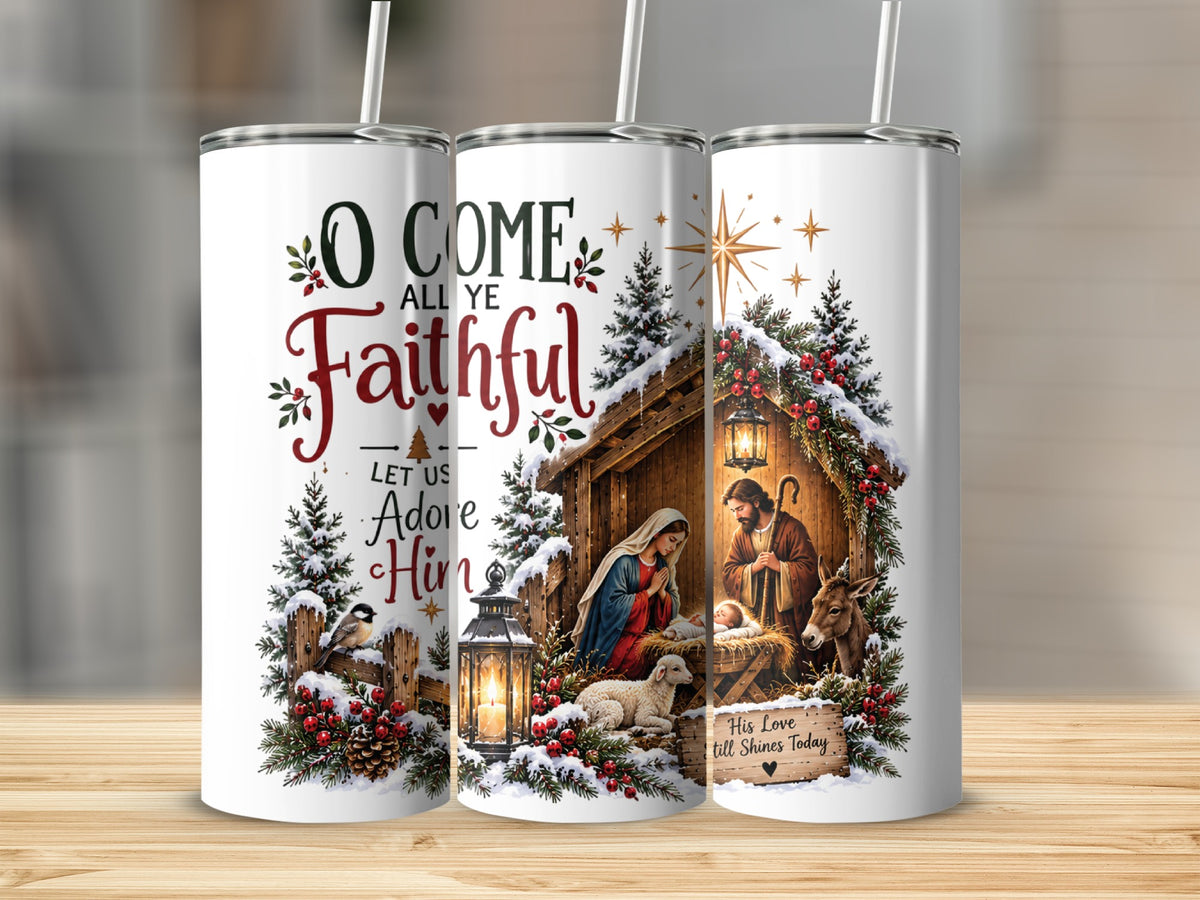 Three white tumblers with straws feature a Christmas nativity scene, pine trees, and text reading O Come All Ye Faithful.